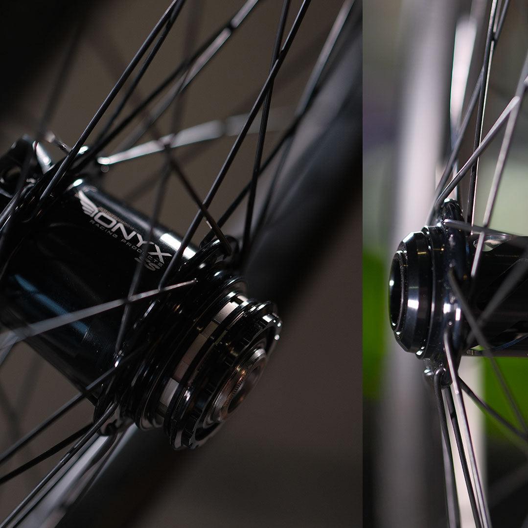 Close-up of the Spectre NME X Onyx Elite 20 Inch Disc Wheel Set (20mm/15mm) with Onyx Helix hub and black spokes, shown from two angles—ideal for BMX wheel enthusiasts.