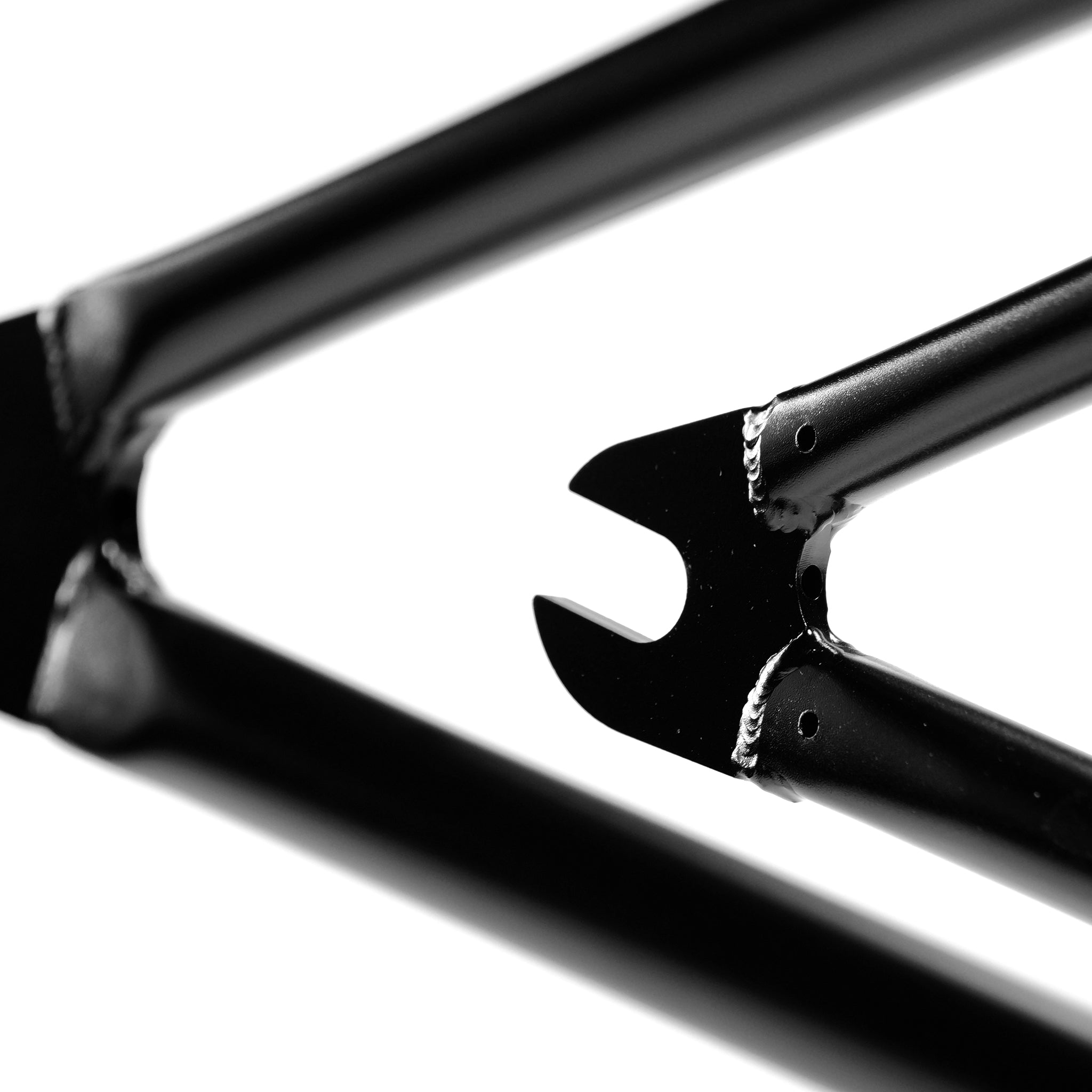 Close-up of the Federal Jarvis V2 Frame’s black BMX dropout, showcasing clean welds and lines against a white background. Removable brake mounts offer added versatility for this street bike frame.