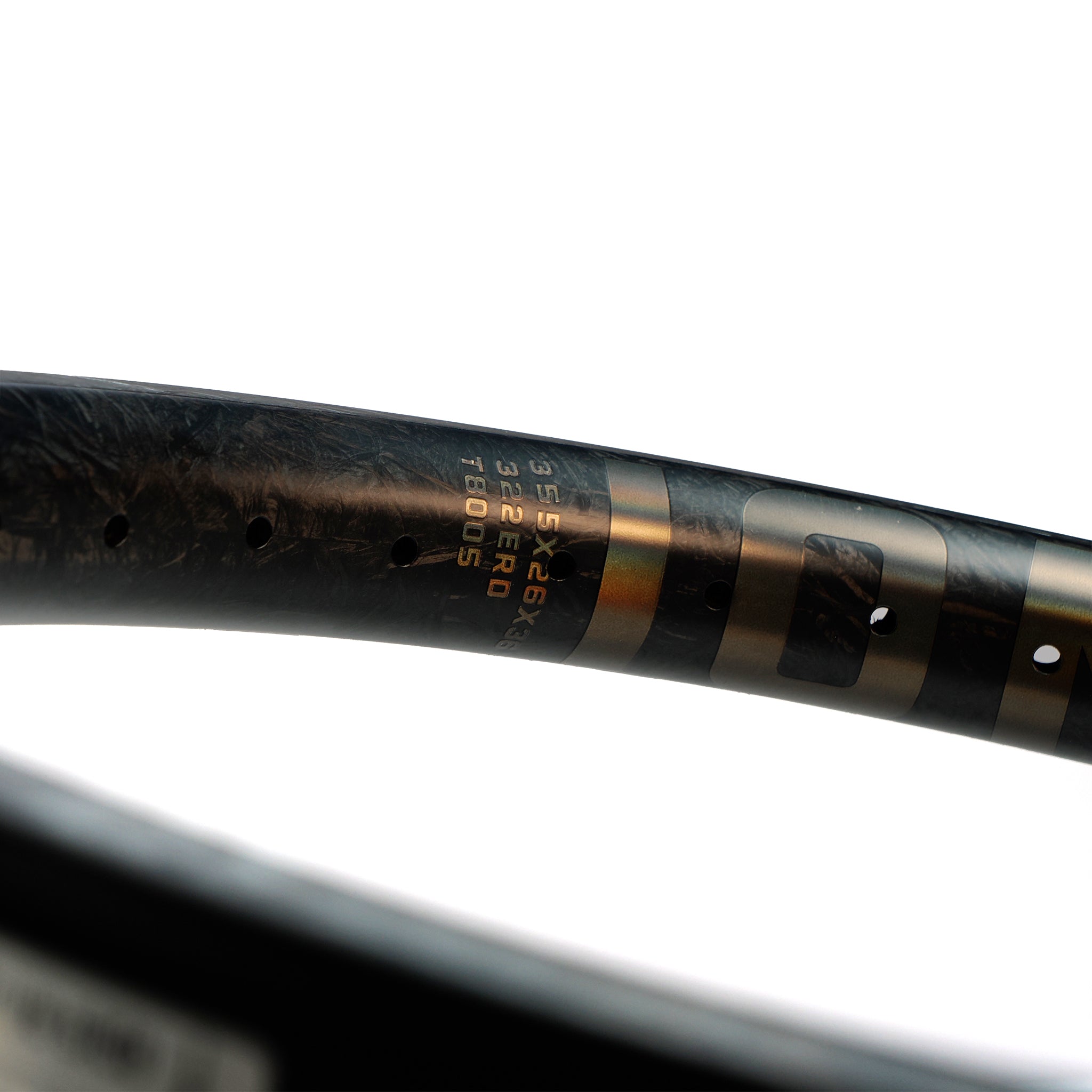 Close-up of a black ION BMX C18 Carbon Fiber 18 Inch Braking Rim showing specifications and serial numbers in gold text.