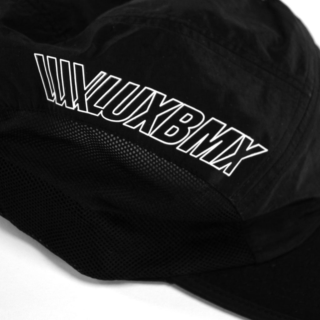 A LUXBMX Bike Athletics Cap - Black with the word luxbmx on it.