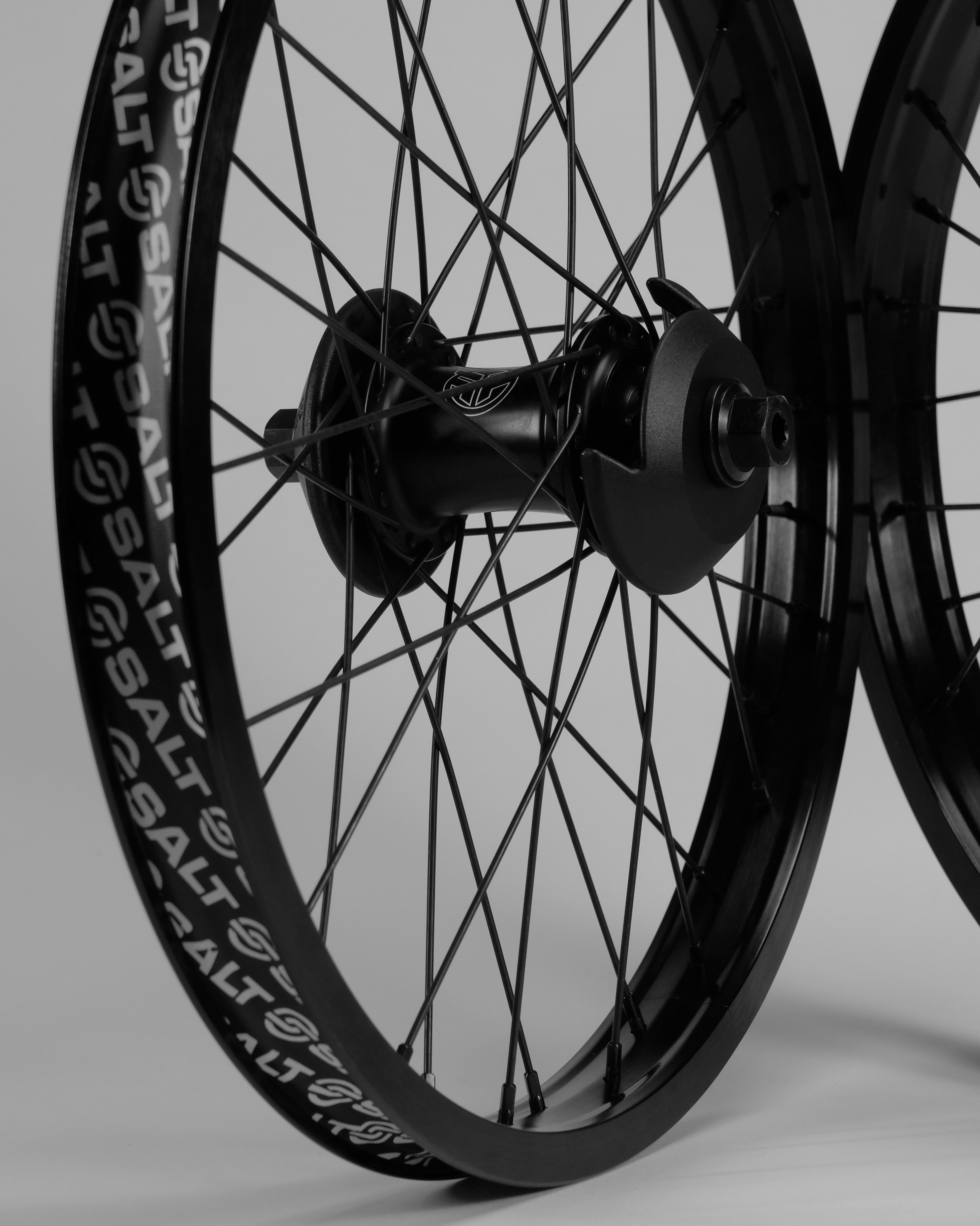 Two Federal Stance Pro x Alienation 18 Custom Wheelsets with intricate spokes and branded tire sidewalls, set against a plain background.