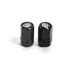 Two black LUXBMX Hex Logo Alloy Valve Caps with a white logo are placed side by side on a white background, highlighting their durable machined alloy build—ideal for stylish BMX upgrades.