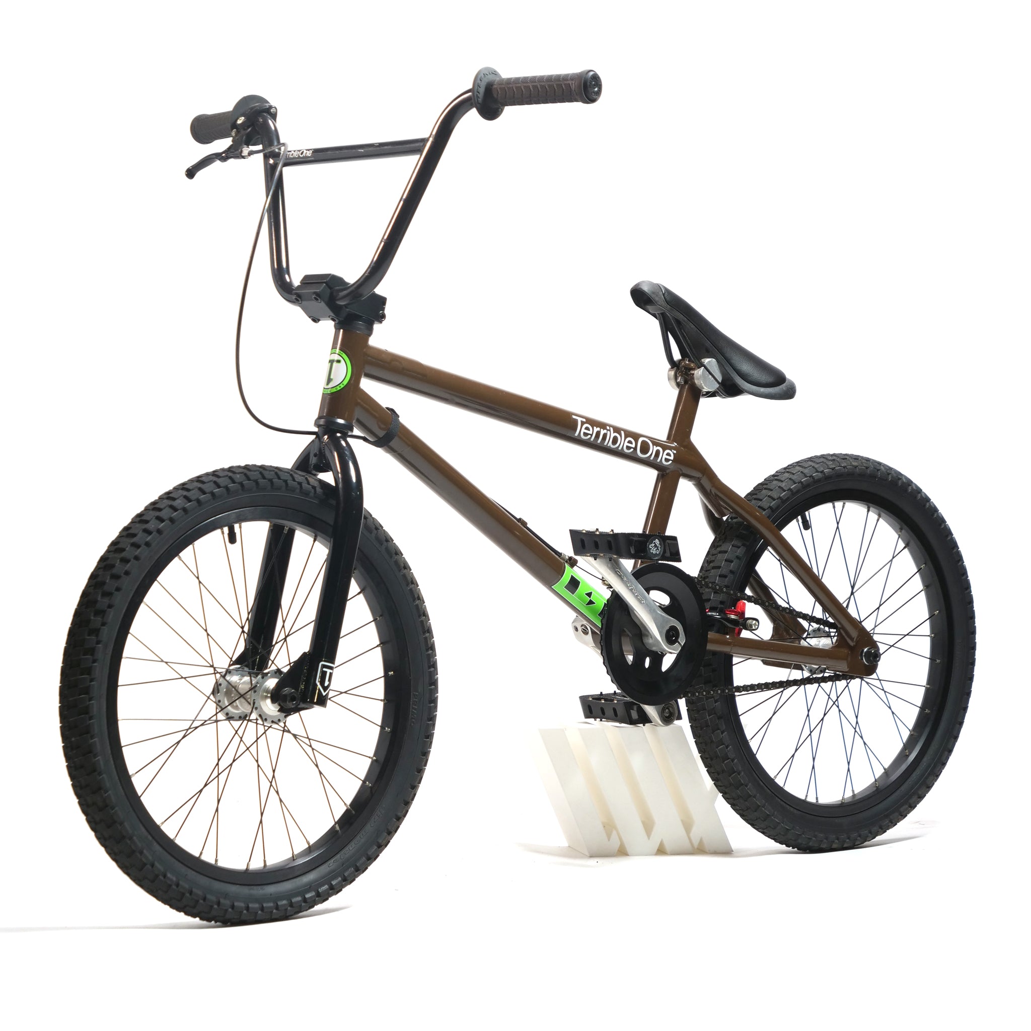 Brown Terrible One Barcode Garrett Byrnes Custom 20 Inch BMX Bike (2003) with black handlebars, seat, and tires, sporting the signature logo on a classic Mid School frame, displayed on a white stand against a plain background.