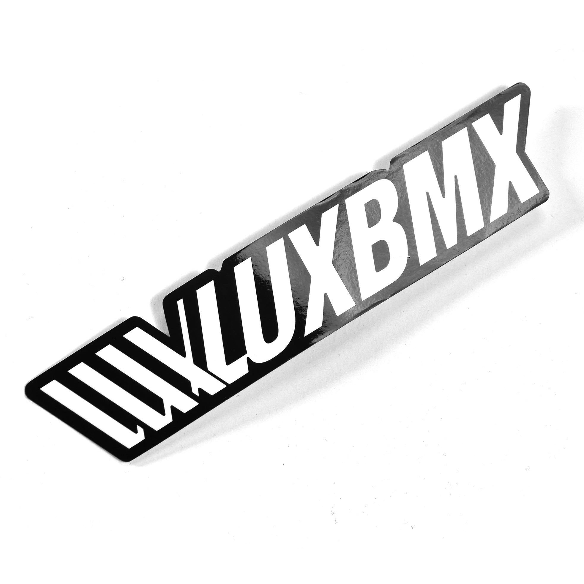 The LUXBMX Athletic Sticker - Fill features bold uppercase "LUXBMX" lettering in black and white with a stylized shadow effect on a white background.