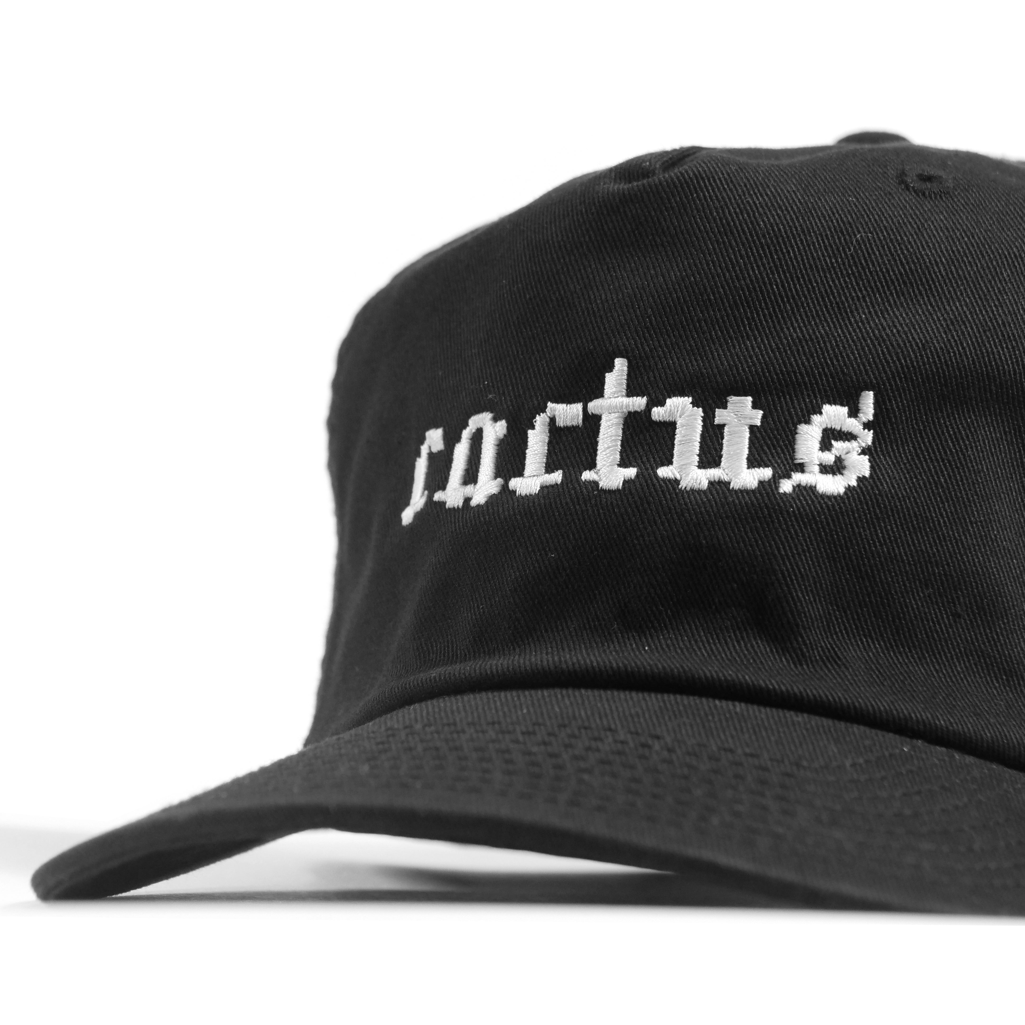 The Cactus BMX Mag Dead Cap Black is a cotton hat featuring a pixel-goth cactus logo and the word "cactus" embroidered in white on the front, offering a modern update to the classic dead cap style.
