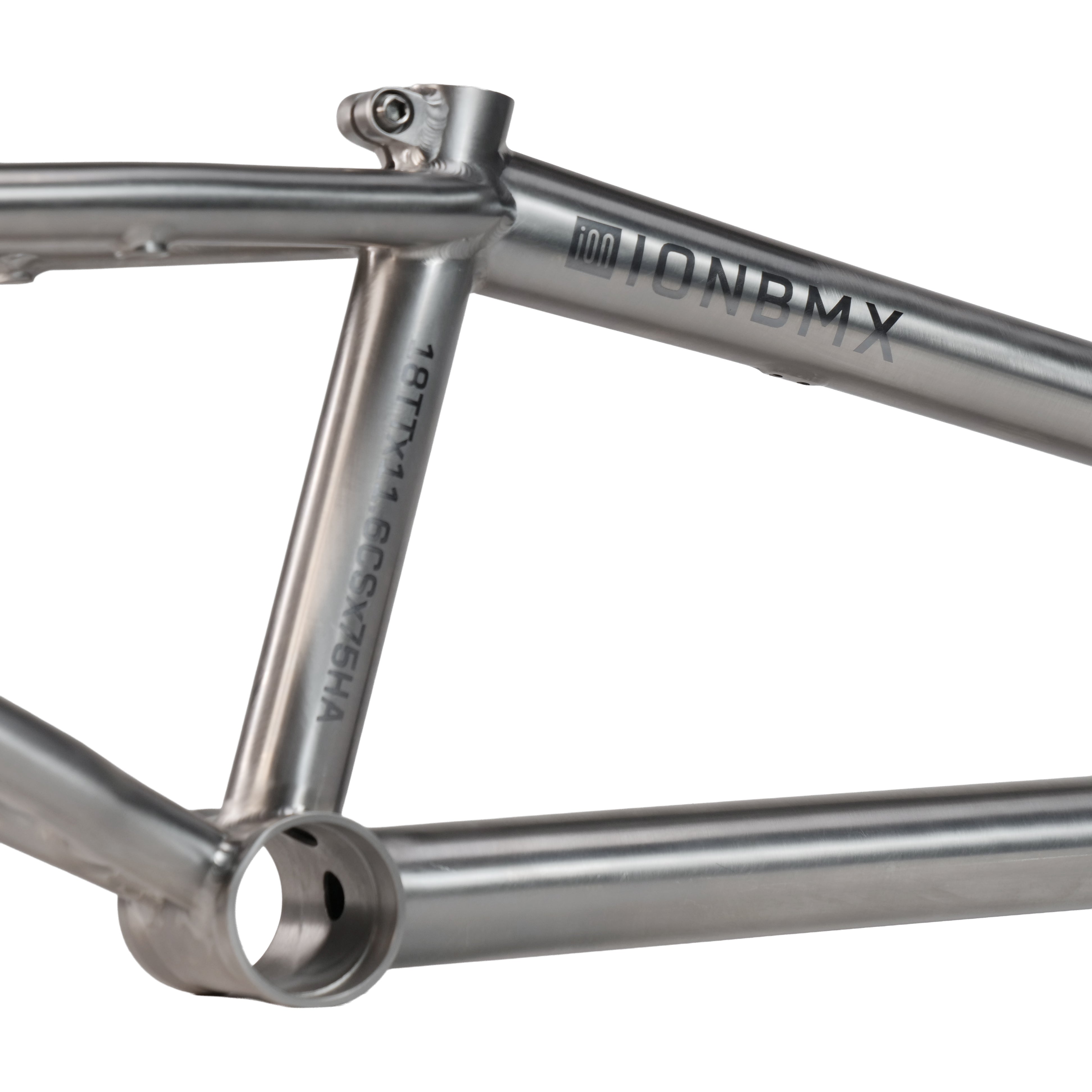 Close-up of the ION BMX Ti18 Titanium 18 Inch Frame, showcasing its silver finish, welded joints, tubing, and engraved details including "ION BMX" and frame specifications.