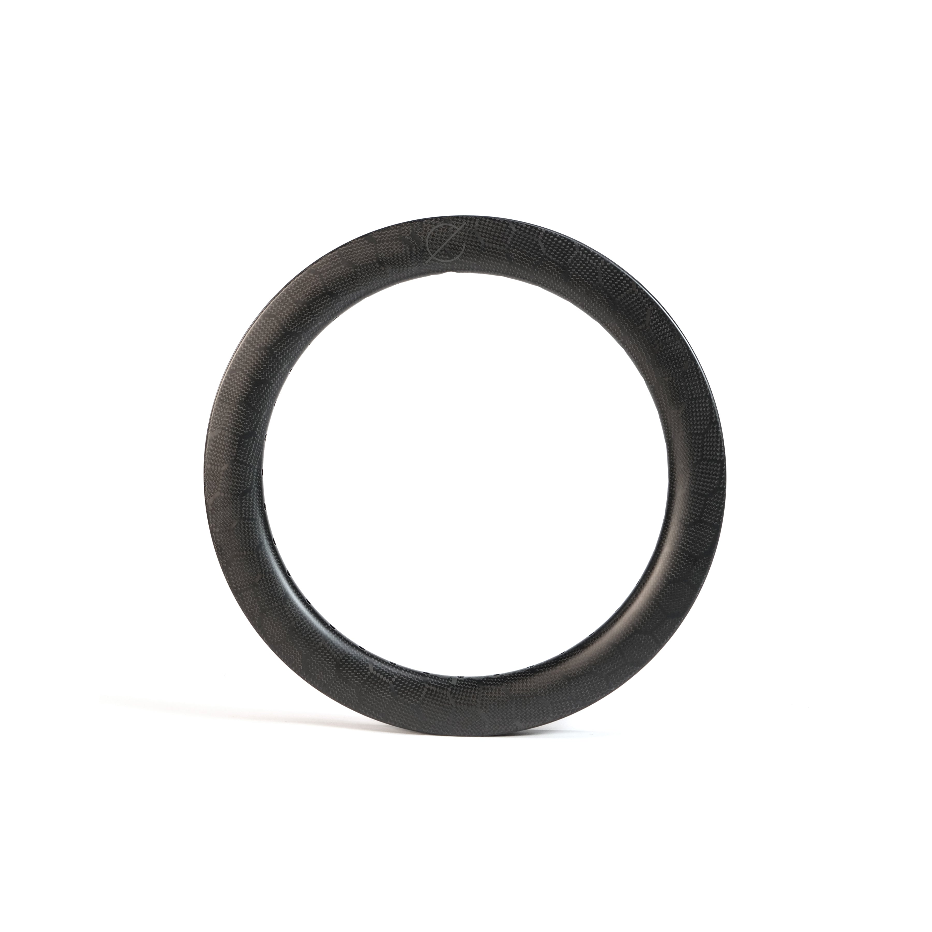 A Spectre V2 Carbon Fiber 16 Inch 36H Brake Rim with a black textured finish stands upright on a plain white background.