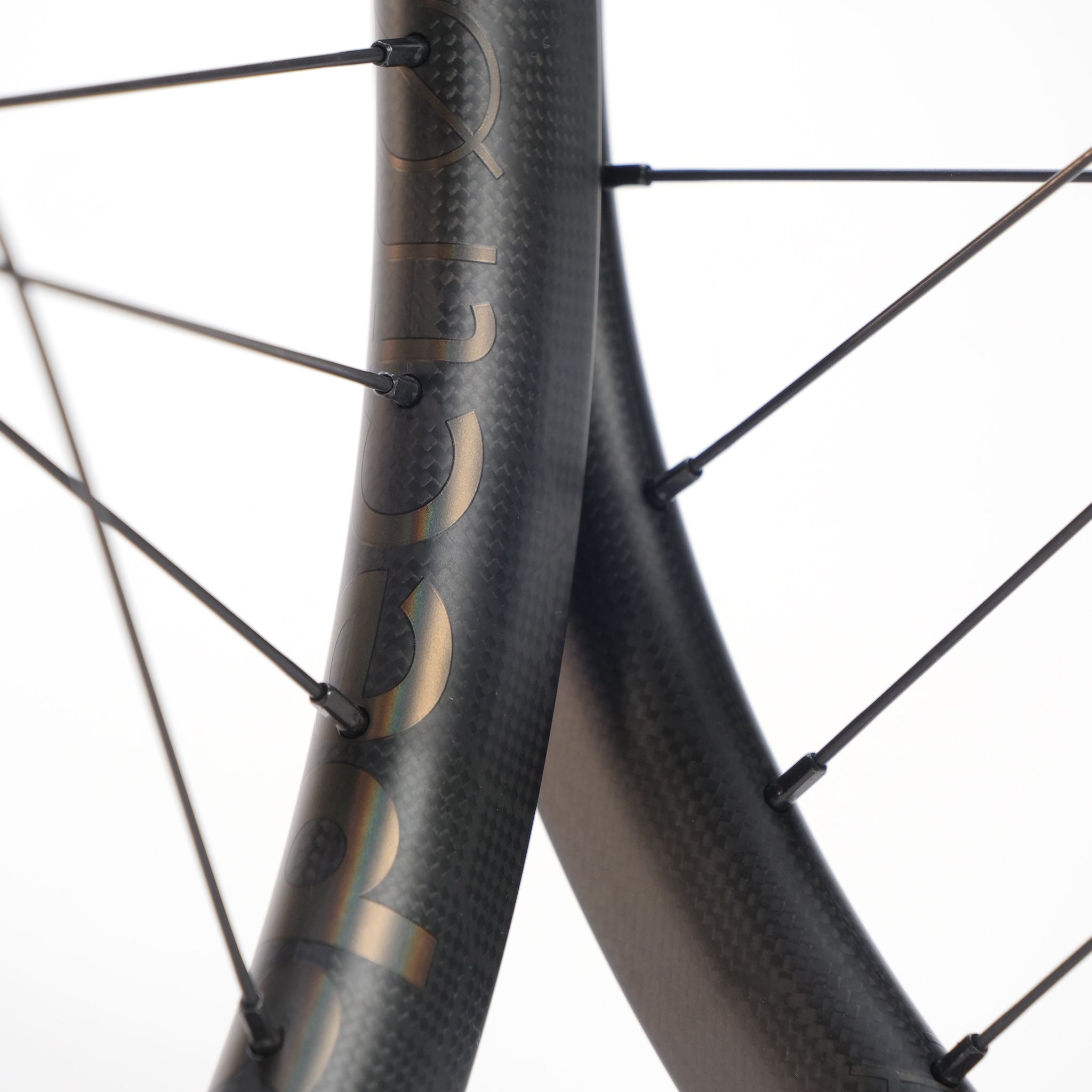Close-up of two black Spectre X Onyx 451 Disc Wheel Set rims with visible spokes and a subtle logo, highlighting the lightweight performance of these BMX race wheels.