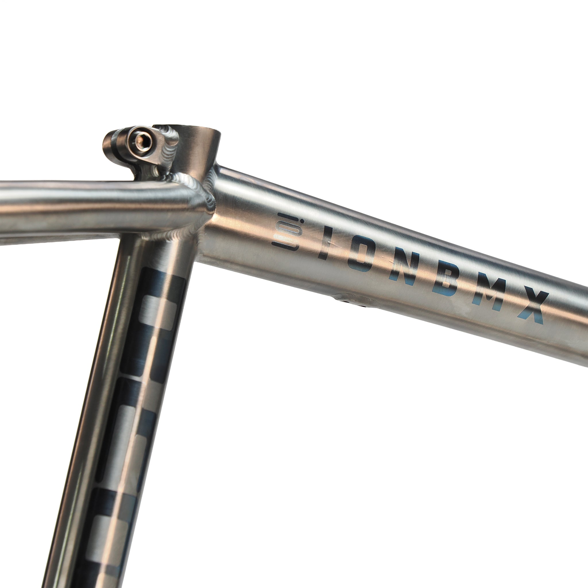 Close-up of the ION BMX AMP20 Titanium 20 Inch Frame, featuring aerospace-grade titanium and "IONBMX" text with geometric patterns accenting the seat tube and top tube.