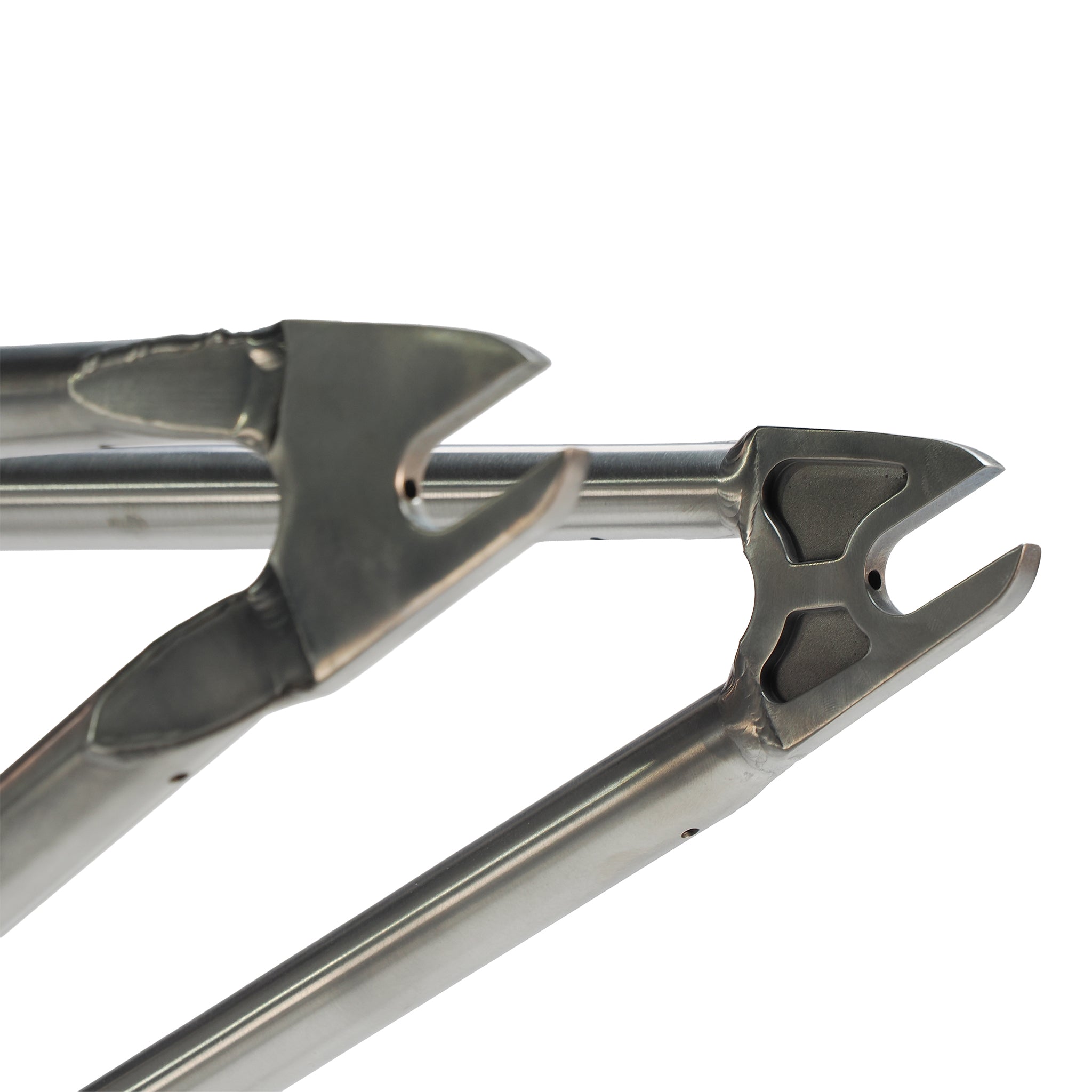 Close-up of two aerospace-grade titanium dropouts on the ION BMX AMP20 Titanium 20 Inch Frame, highlighting clean welds and rear wheel axle attachment points.