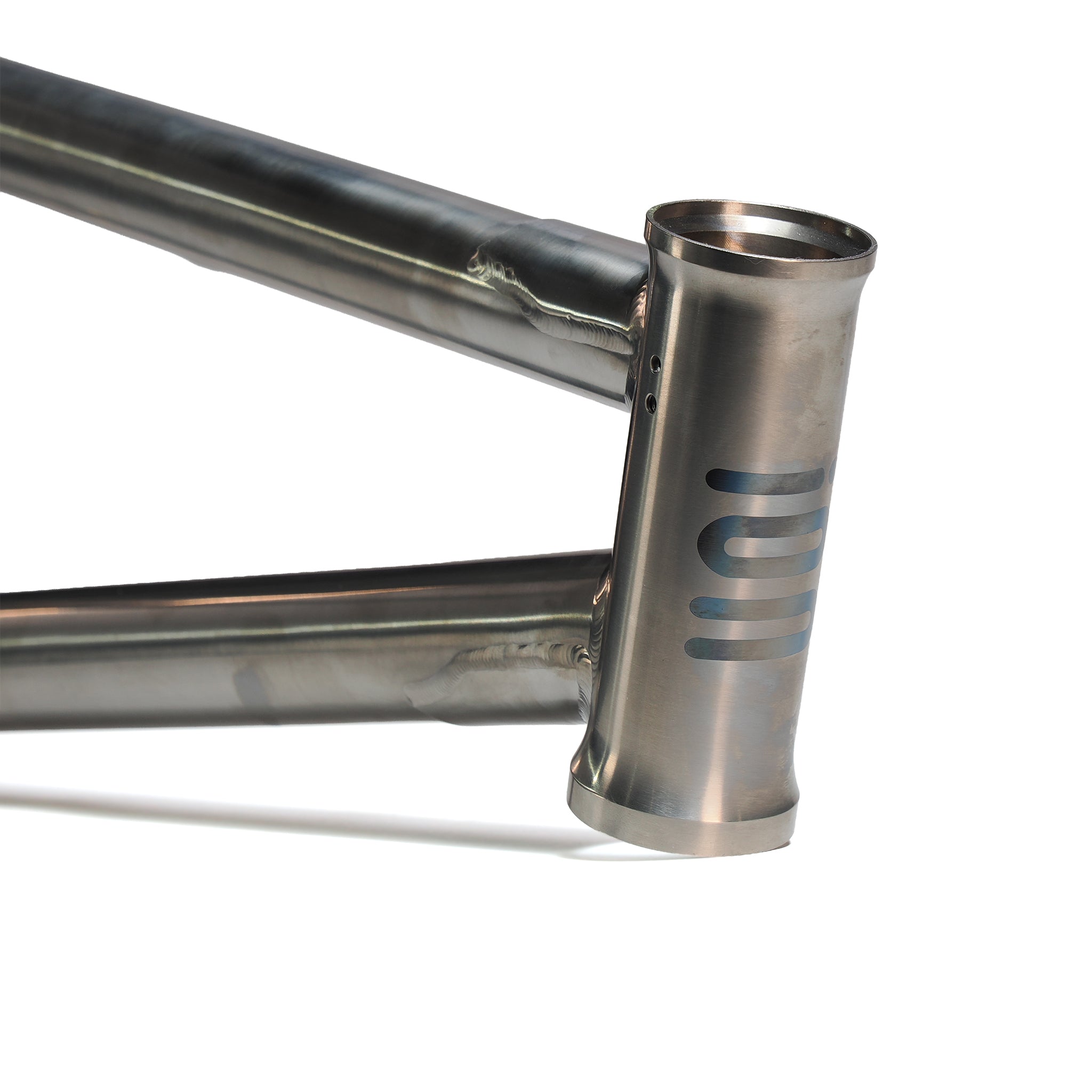 Close-up of the ION BMX AMP20 Titanium 20 Inch Frame, showing aerospace-grade titanium construction with visible welds and a head tube logo of horizontal lines, isolated on a white background.