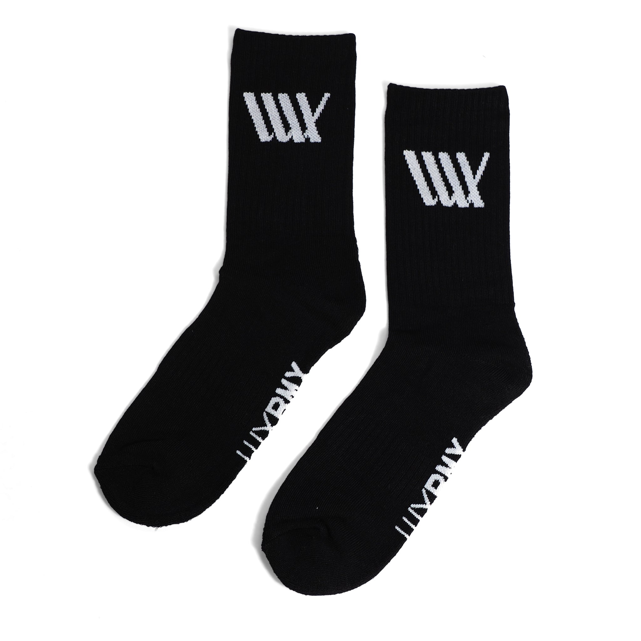 LUXBMX Crew Socks are black cotton blend socks featuring a white "UNDR" logo by the toes and a stylized white "W" on the leg, offering comfort and style for daily wear or BMX sessions.