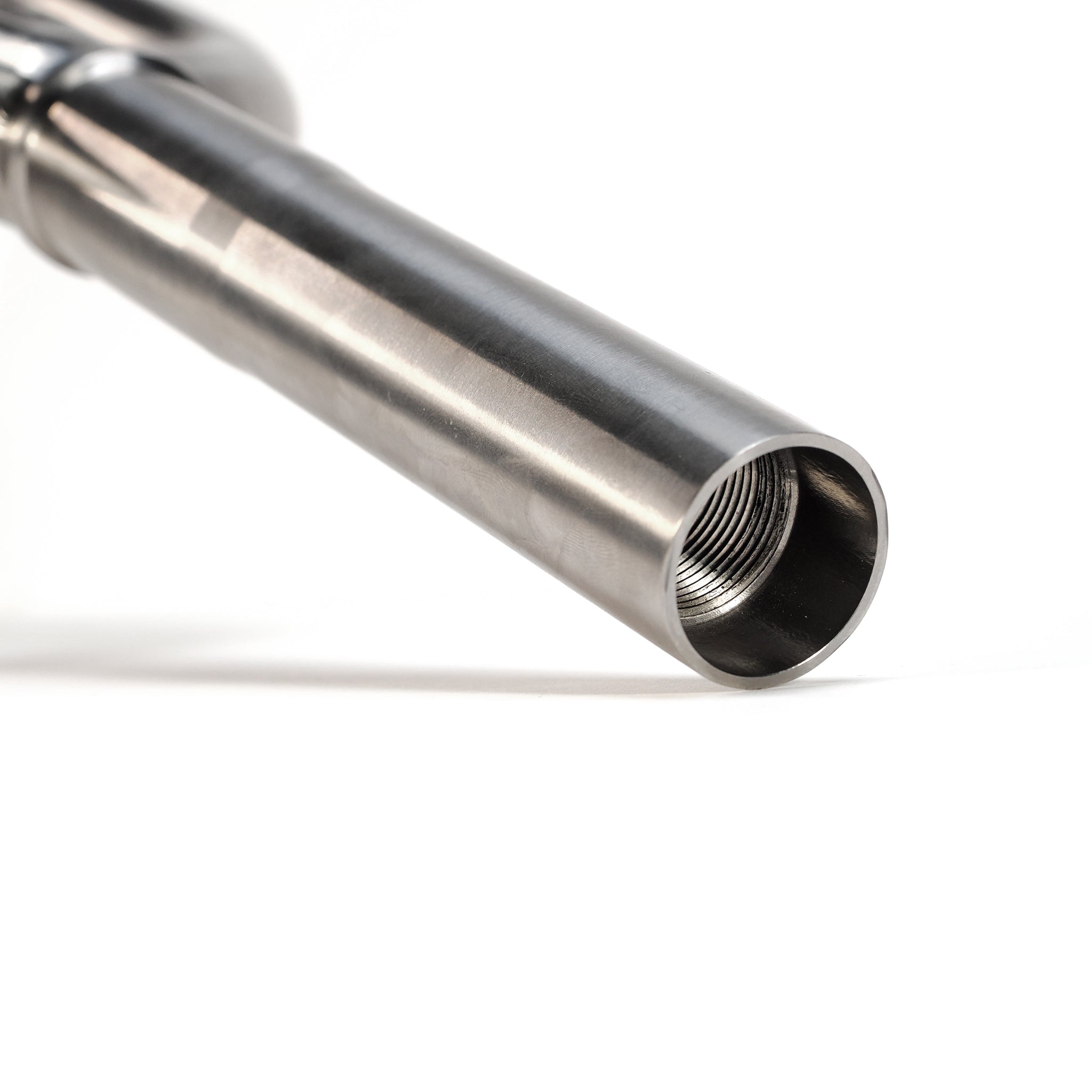 Close-up of ION BMX Ti18 Titanium 18 Inch Forks, showing the metallic cylindrical tube with internal threading on one end, placed on a white background.