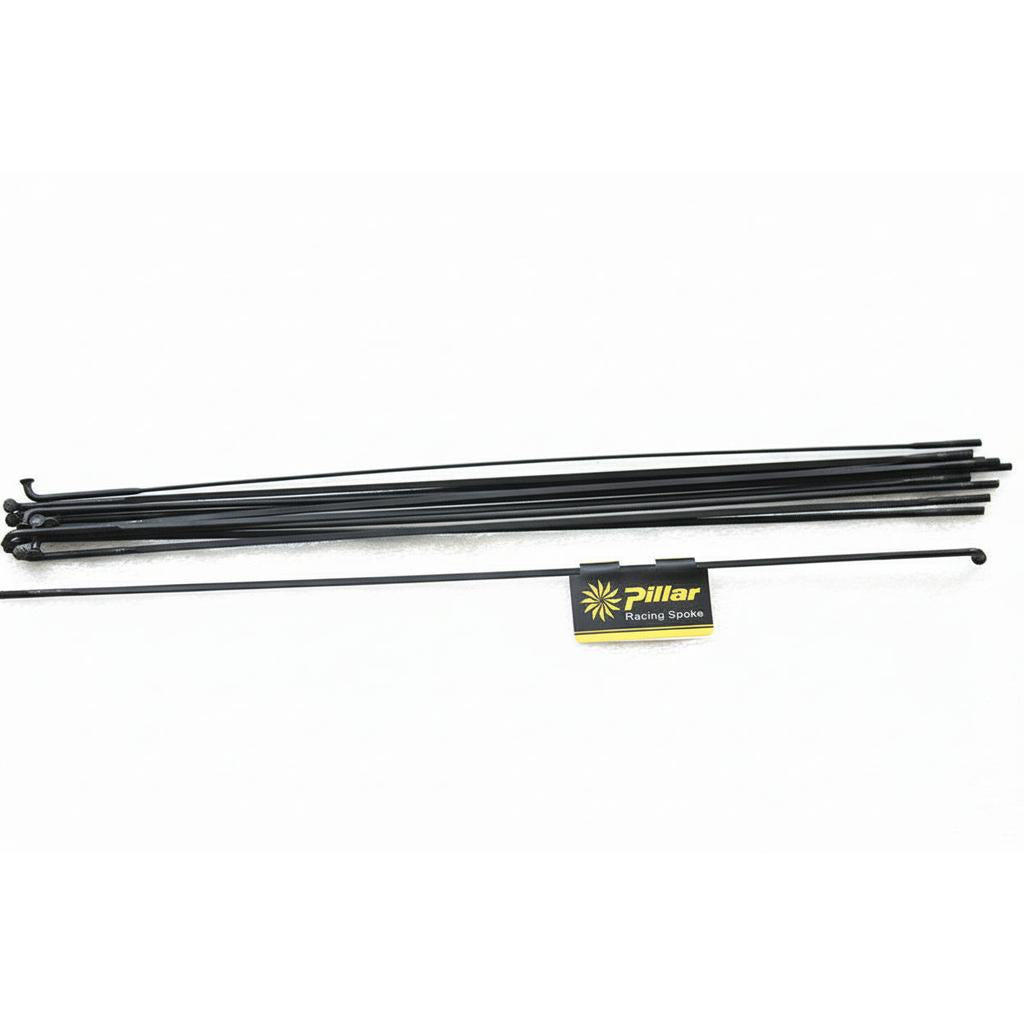 A set of black J-Bend PSR WING 21 bladed spokes (2.2/2.1/1.3/2.0) arranged in a line beside the product packaging, on a white background. Pack of 4, no nipples included.