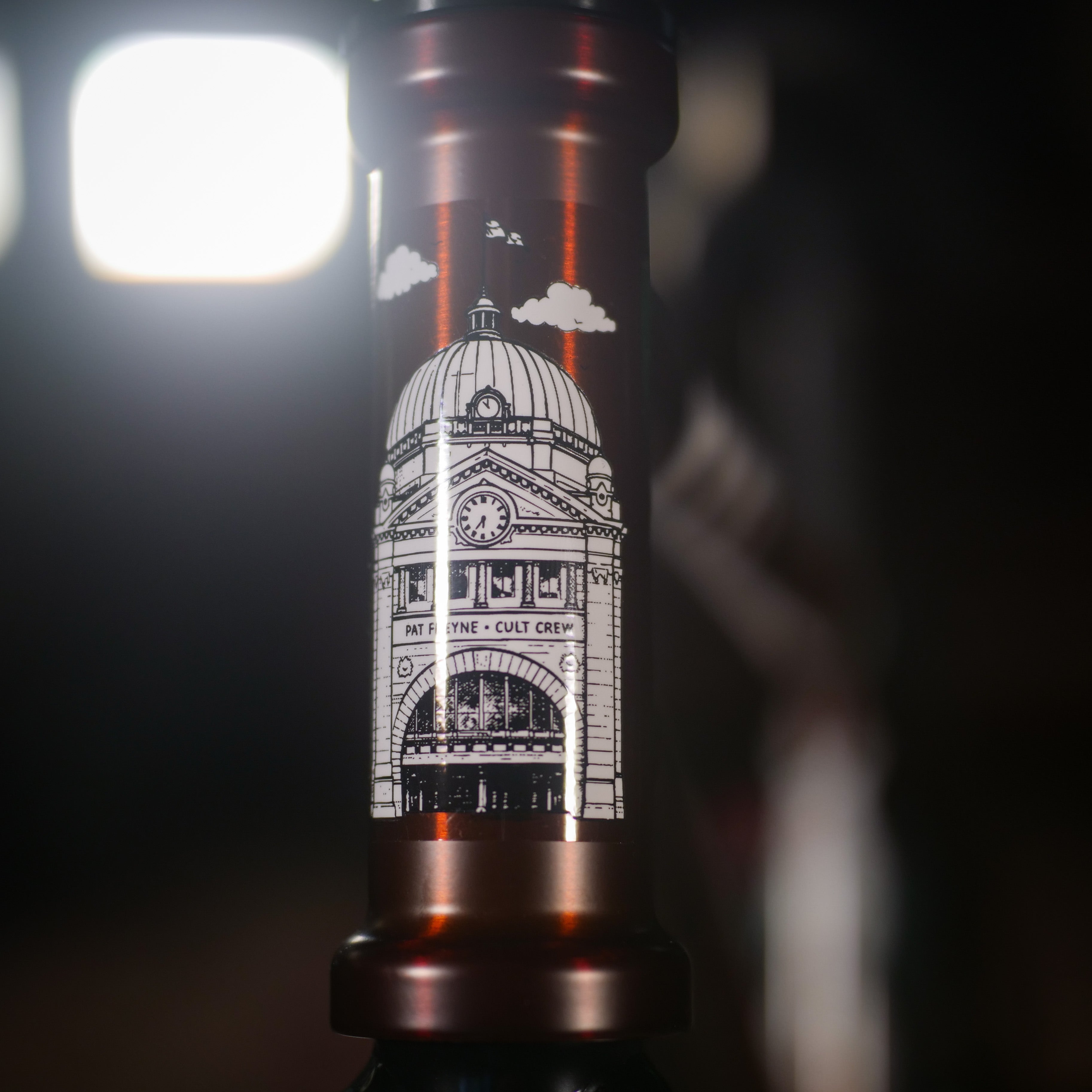 Close-up of a Cult Dak X Eclat Custom 'Pat Freyne Signature' head tube, featuring a domed building illustration and "PAT PAYNE - CULT CREW" label—ideal for BMX enthusiasts seeking unique bike parts and standout designs.