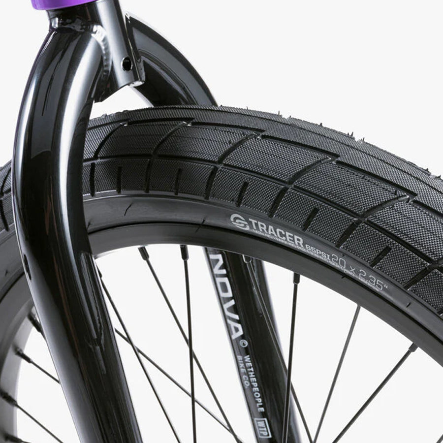 A close up of a Wethepeople Nova 20 Inch BMX Bike tire on a white background.