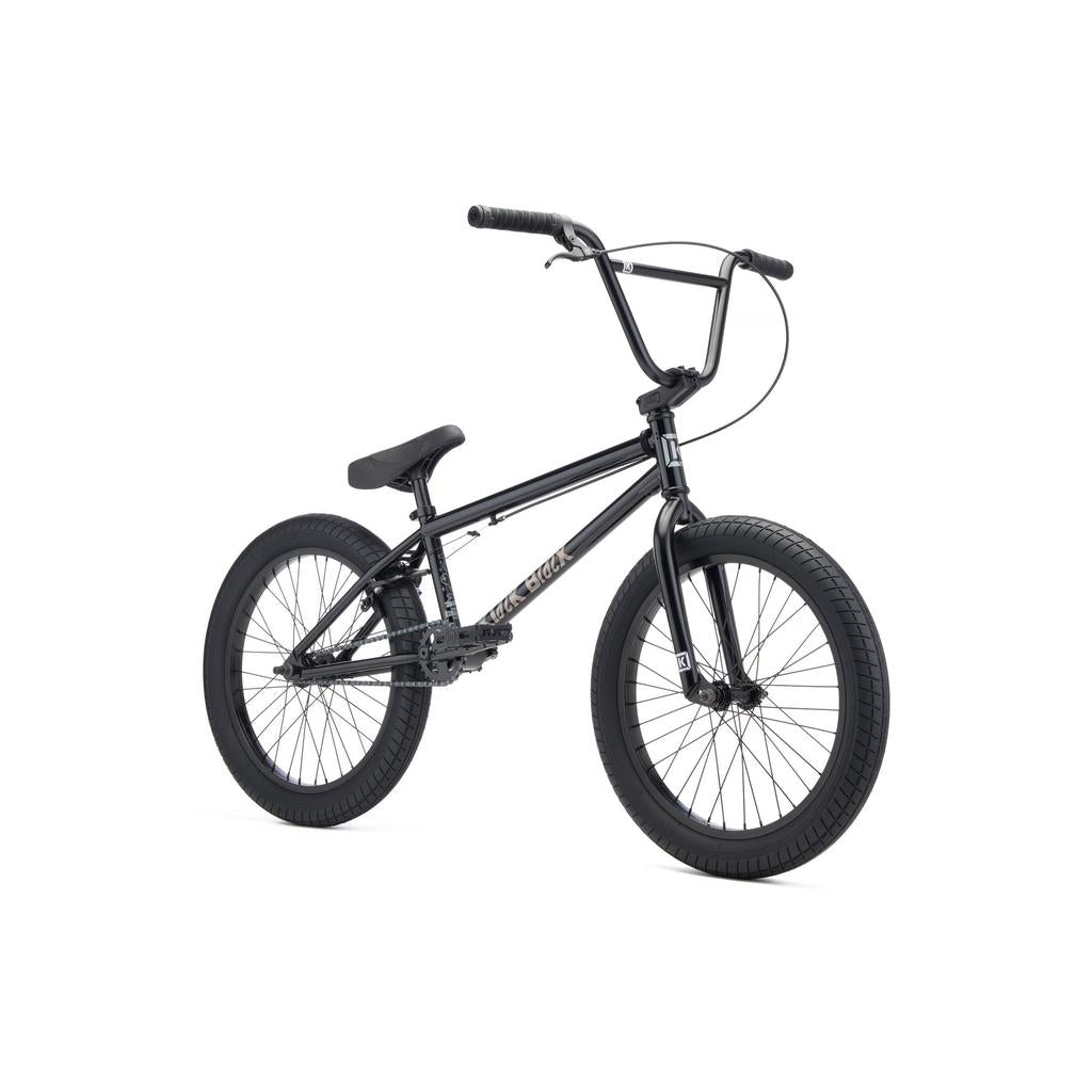 The Kink Curb 20 Inch Bike (2027) is a black BMX with a compact frame, thick tires, straight handlebars, and Mission parts, shown on a white background—ideal for beginners.