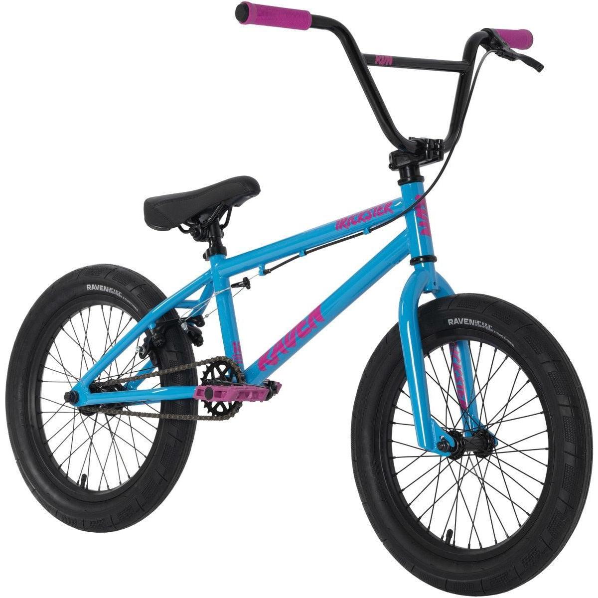 The Raven Trickster 18 Inch Bike is blue with black tires, seat, and handlebars with pink grips, pink pedals, pink accent text on the frame, chromoly cranks, and sealed bearing hubs for smooth performance.
