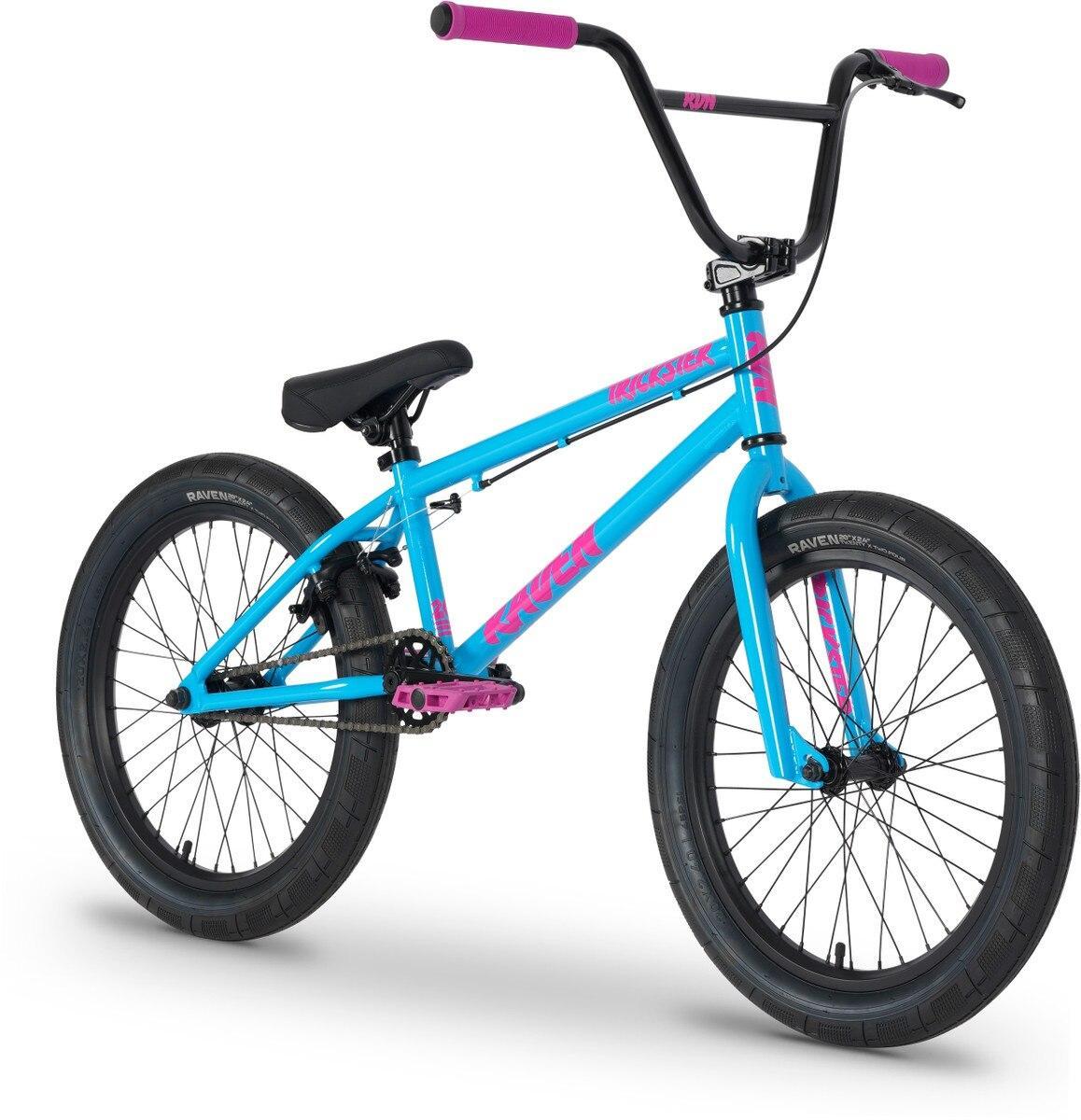 The Raven Trickster 20 Inch Bike, an entry-level BMX in blue with pink grips, pedals, decals, black tires, and a black saddle, is displayed on a white background.