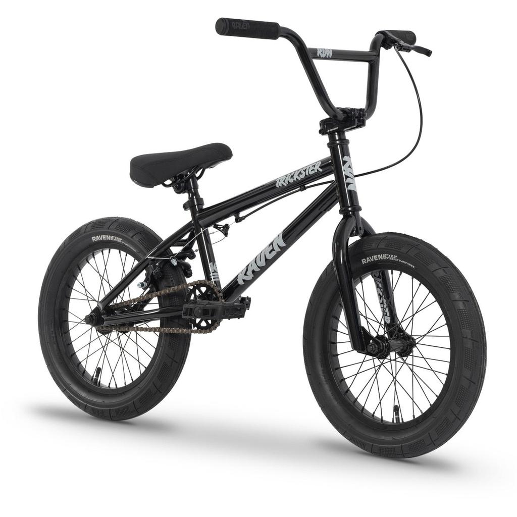 The Raven Trickster 16 Inch Bike, featuring thick tires, chromoly cranks, a padded seat, and high handlebars, is displayed in black against a white background.