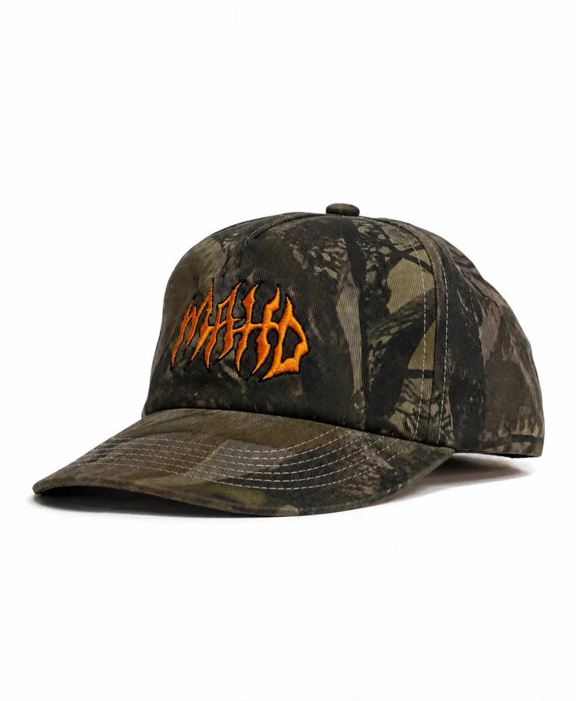 A Mahd - Metal Hat, featuring a camouflage 5 Panel design with orange embroidered text in a stylized font on the front, displayed against a white background.