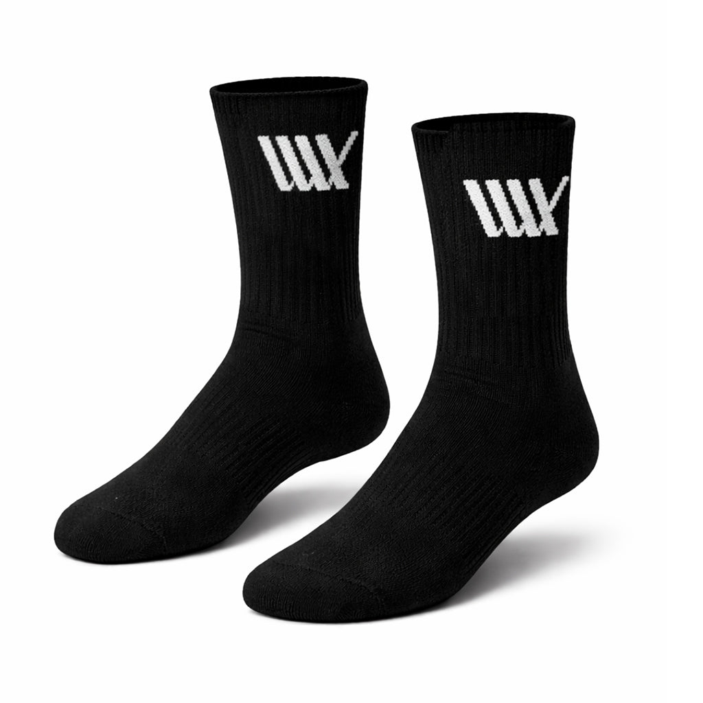 A 3 pack of black LUXBMX Crew Socks featuring a white stylized "W" logo near the top—perfect cotton crew socks for BMX riders.