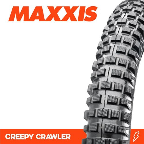 Close-up of a Maxxis Creepy Crawler 20 (19 inch rim) Inch Trials Tyre (not for BMX), featuring a knobby tread pattern, set against a white background with orange branding text.