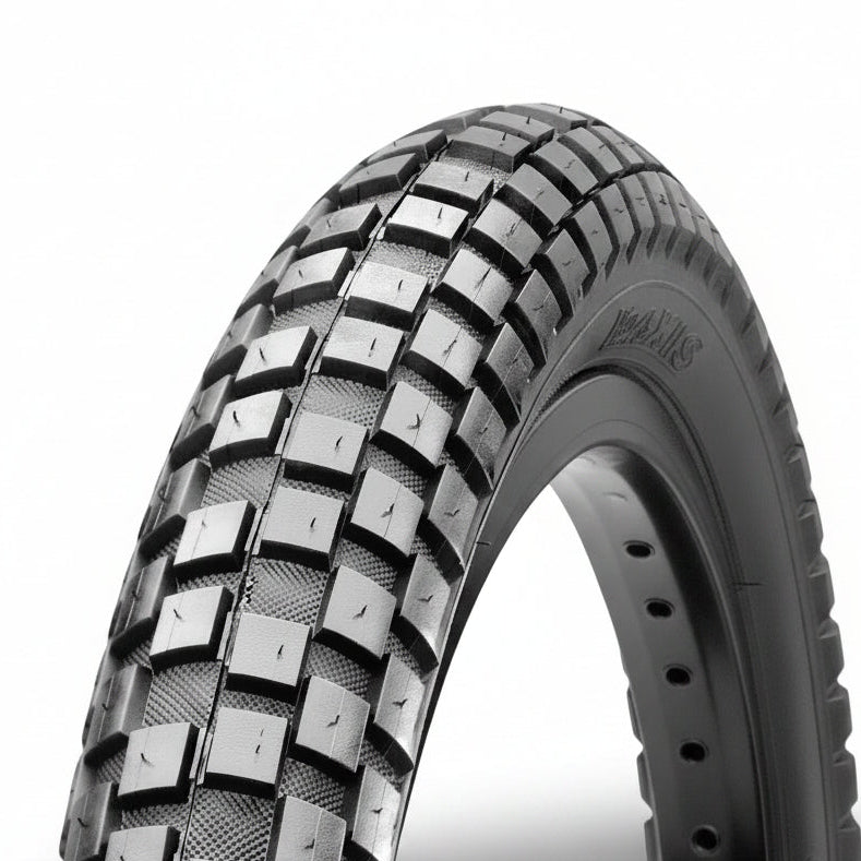 Close-up of a HOLY ROLLER 26" Wire Bead tyre with a knobby tread pattern, designed for off-road or dirt jump use, set against a plain white background.