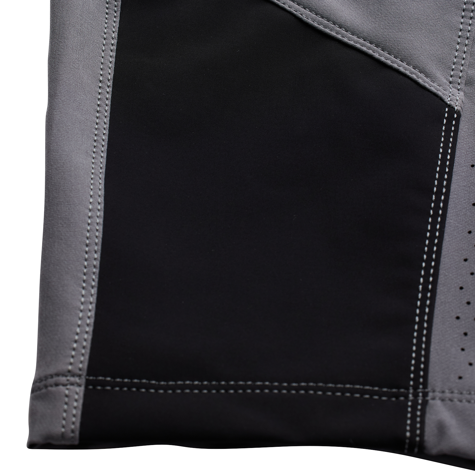 Close-up of a black and grey TLD Youth Sprint Pant Mono Charcoal with stitching and perforated details, designed for BMX racing.