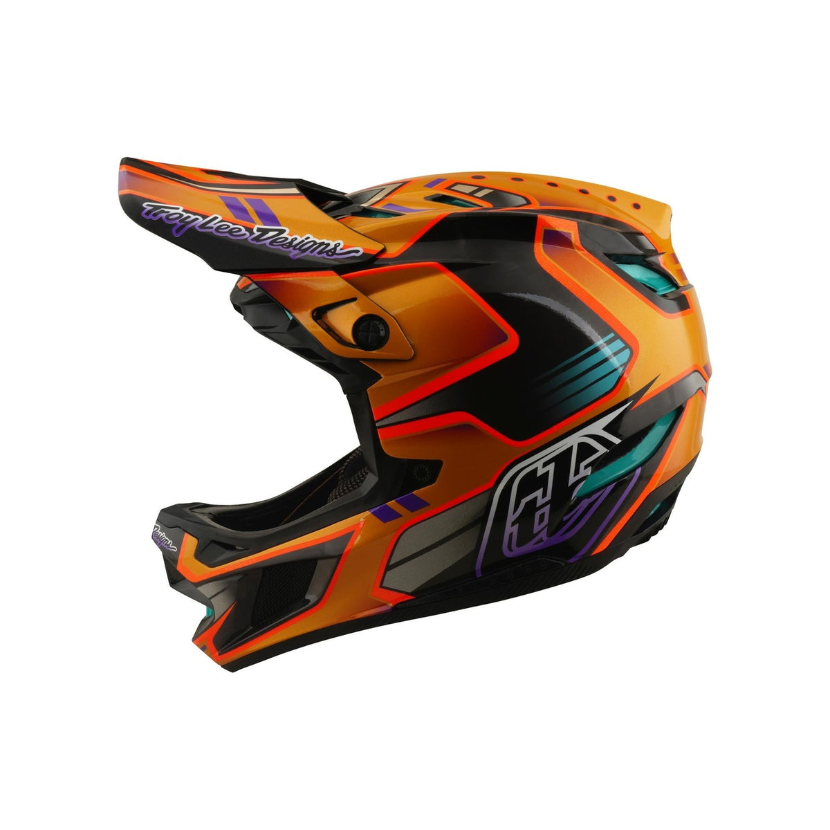 The TLD 26.1 D4 AS Carbon Helmet / Crest Gold is a full-face mountain biking helmet featuring geometric patterns, "Troy Lee Designs" on the visor, and advanced Mips protection for enhanced safety.