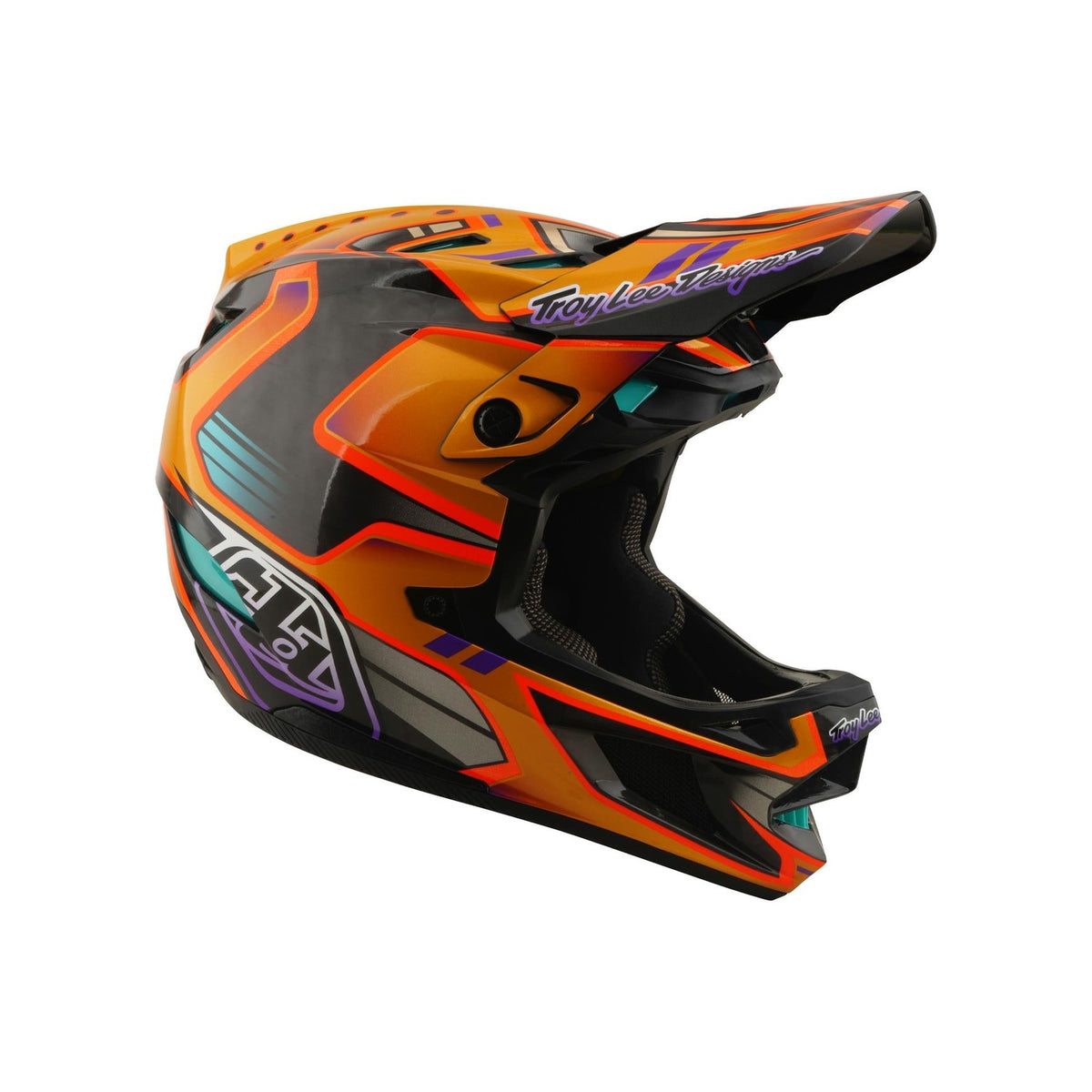 The TLD 26.1 D4 AS Carbon Helmet in Crest Gold is a full-face mountain biking helmet with an aerodynamic design, colorful accents, Mips protection, and "Troy Lee Designs" branding on the visor and chin area.