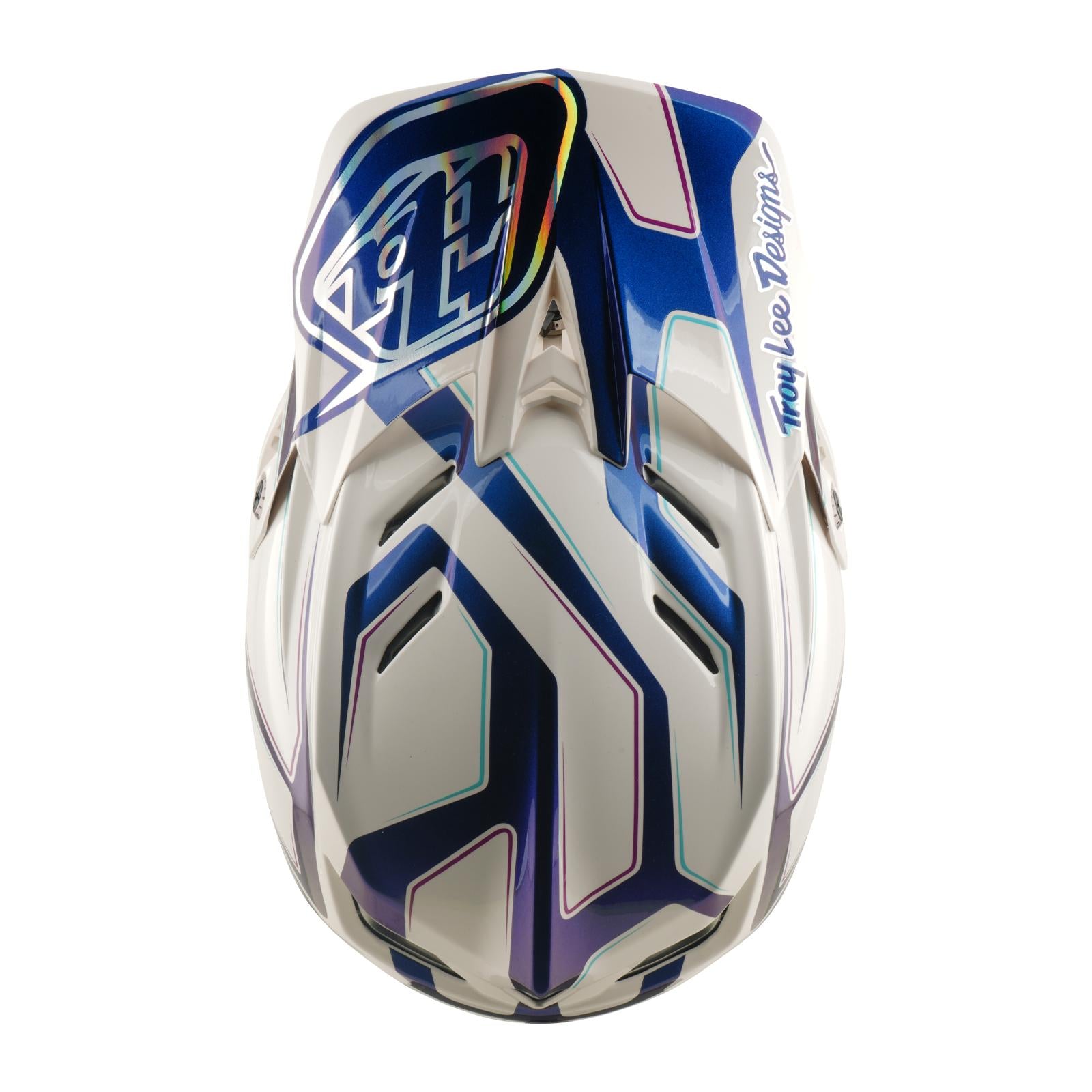 The TLD 26.1 D4 AS Composite Helmet in Flared White/Indigo displays blue and white geometric patterns, the Troy Lee Designs logo, and Mips protection, as seen from above.