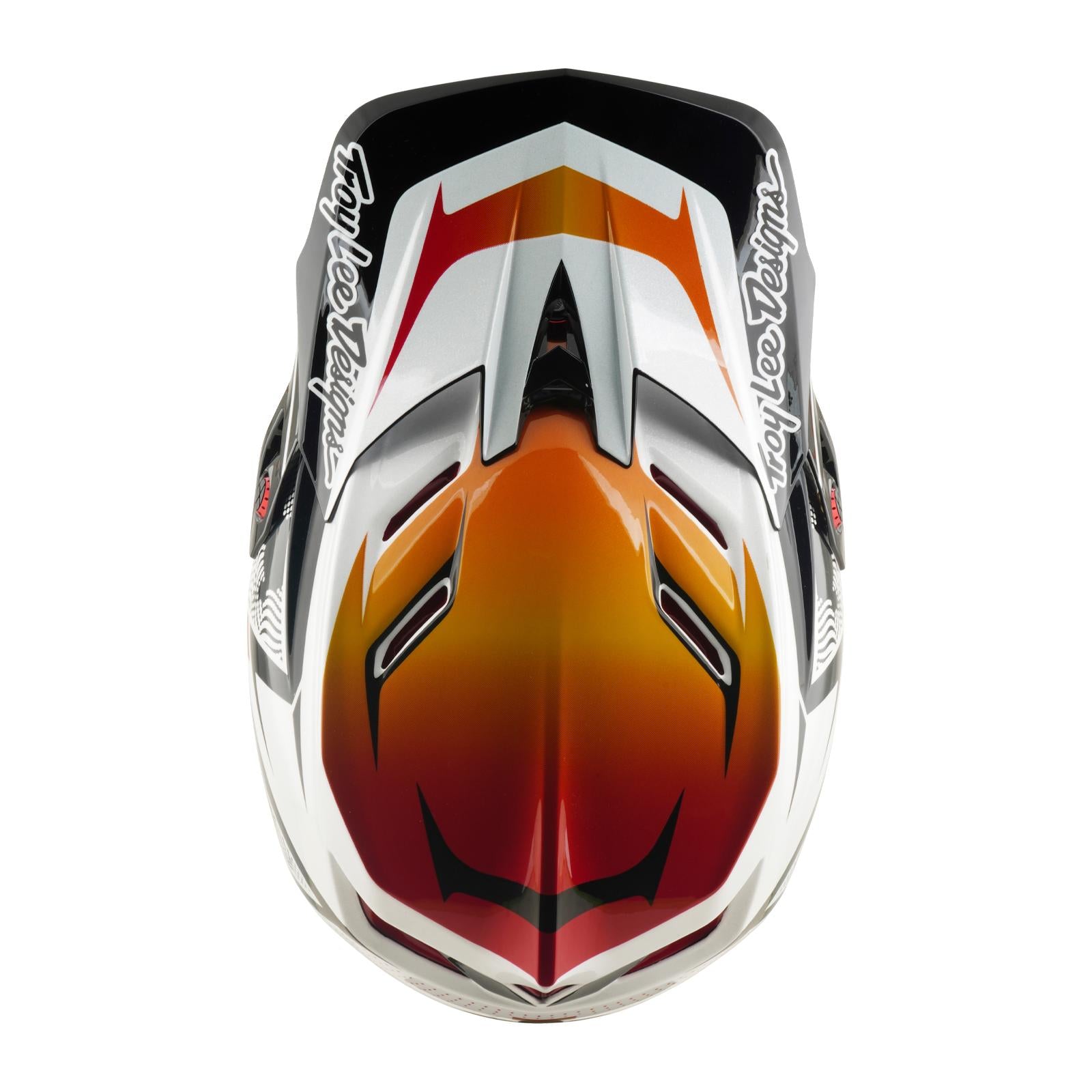 A top view of the TLD 26.1 D4 AS Composite Helmet / Lined Up White showcases its striking red, orange, and white design with "Troy Lee Designs" text on each side, providing standout BMX style and reliable protection for riders.