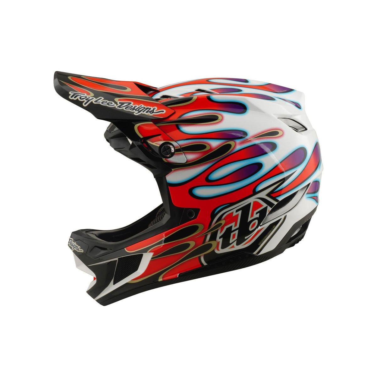 Side view of the TLD 26.1 D4 AS Composite Helmet in Overspray White/Red, featuring red, blue, and purple flame graphics, a visor with Mips protection, and "Troy Lee Designs" logo on both the visor and chin.