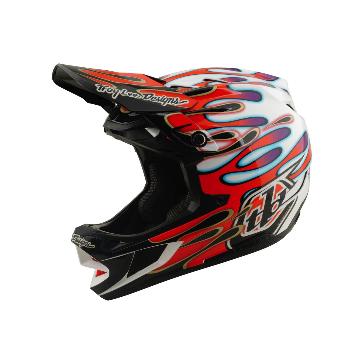 The TLD 26.1 D4 AS Composite Helmet in Overspray White/Red features a red, blue, and purple flame design, black visor, Troy Lee Designs branding on white, and Mips protection for enhanced safety.