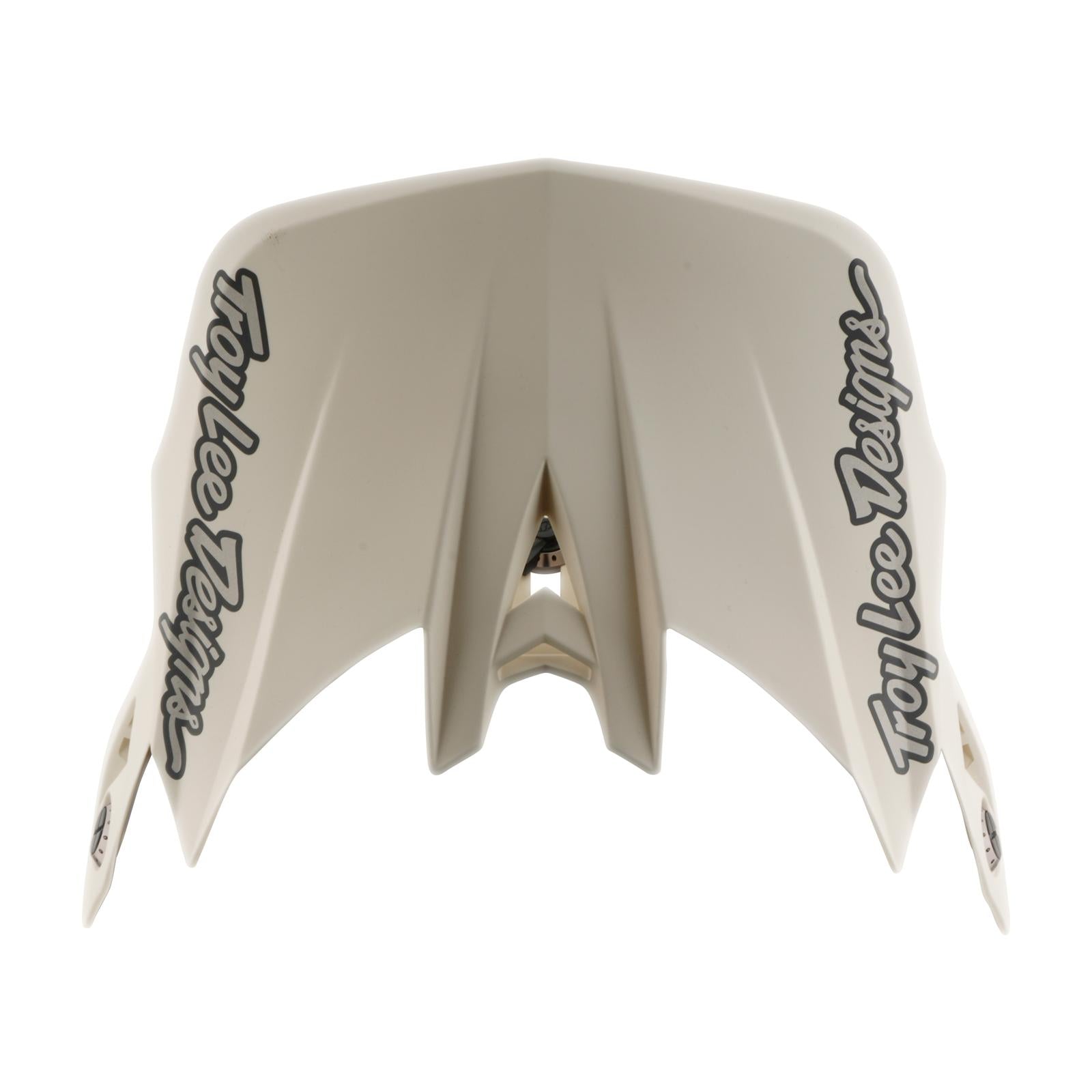 A beige TLD 26.1 D4 AS Composite Helmet / Stealth Pumice visor with black “Troy Lee Designs” logos on both sides, shown on a white background—compatible with BMX helmet models and the Mips protection system.