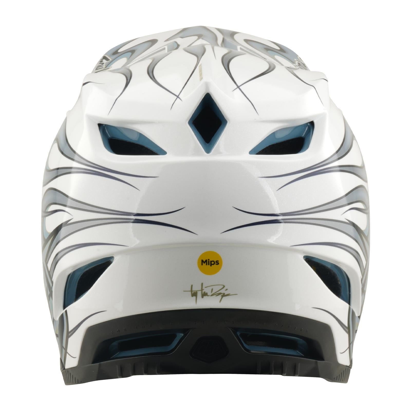 Rear view of the TLD 26.1 D4 AS Composite Helmet in Torched White/Silver, featuring black and gray graphic lines, ventilation openings, a yellow Mips protection sticker, and a signature printed near the bottom.