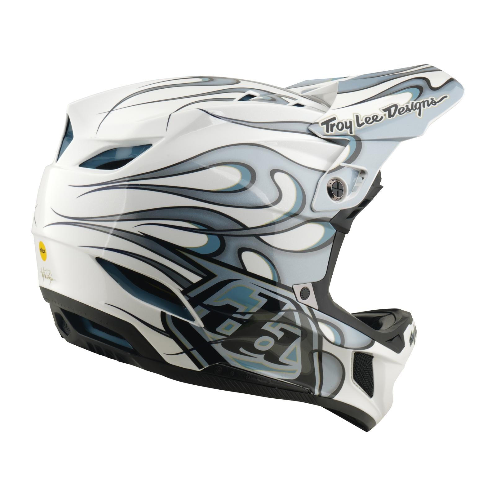 The TLD 26.1 D4 AS Composite Helmet in Torched White/Silver features gray and black flame graphics, the "Troy Lee Designs" logo on the visor and side, Mips protection for safety, and is shown from a side view.