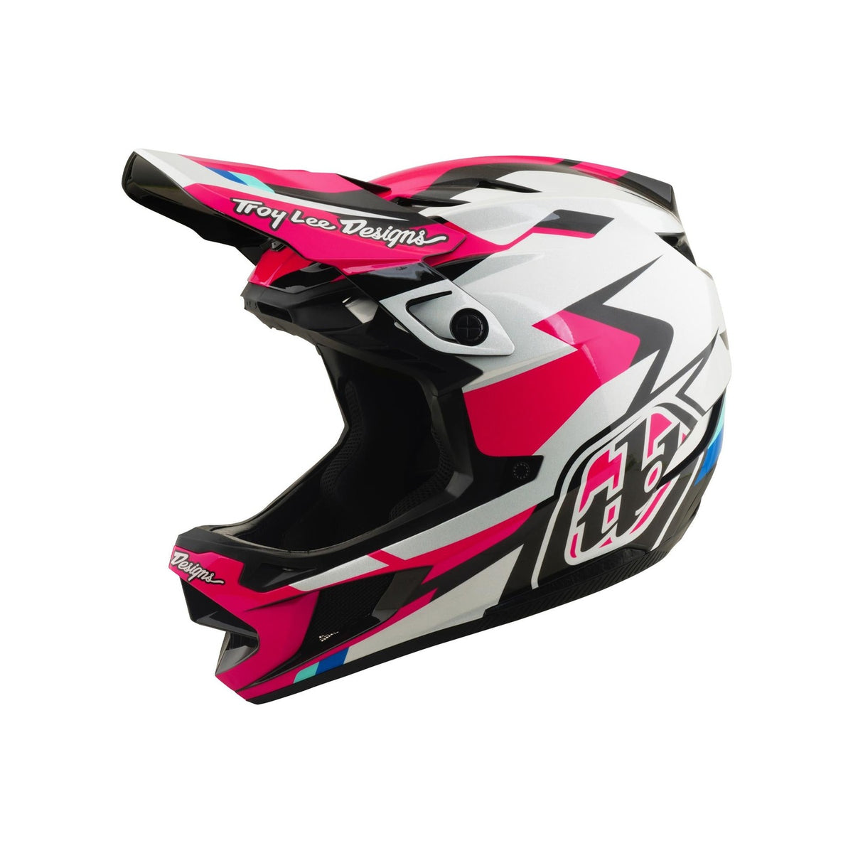 The TLD 26.1 D4 AS Polyacrylite Helmet / Roamer Magenta is a full-face motocross helmet with a pink, white, black, and blue geometric design. It features "Troy Lee Designs" on the visor and is Mips compatible—perfect for mountain biking.
