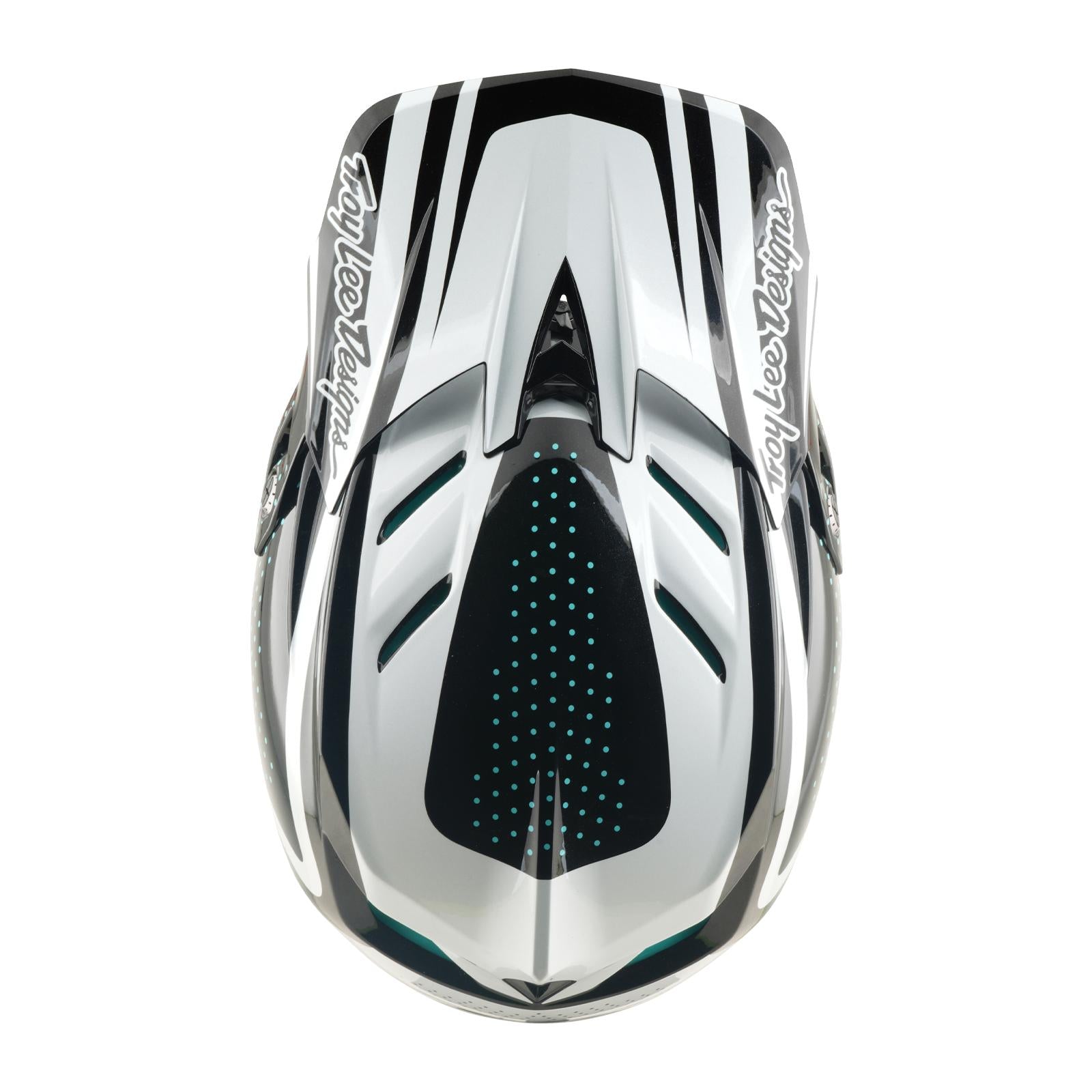 Top view of the TLD 26.1 D4 AS Polyacrylite Helmet in The Line Charcoal/White, featuring geometric patterns, ventilation holes, Mips protection, and "Troy Lee Designs" logos on both sides.
