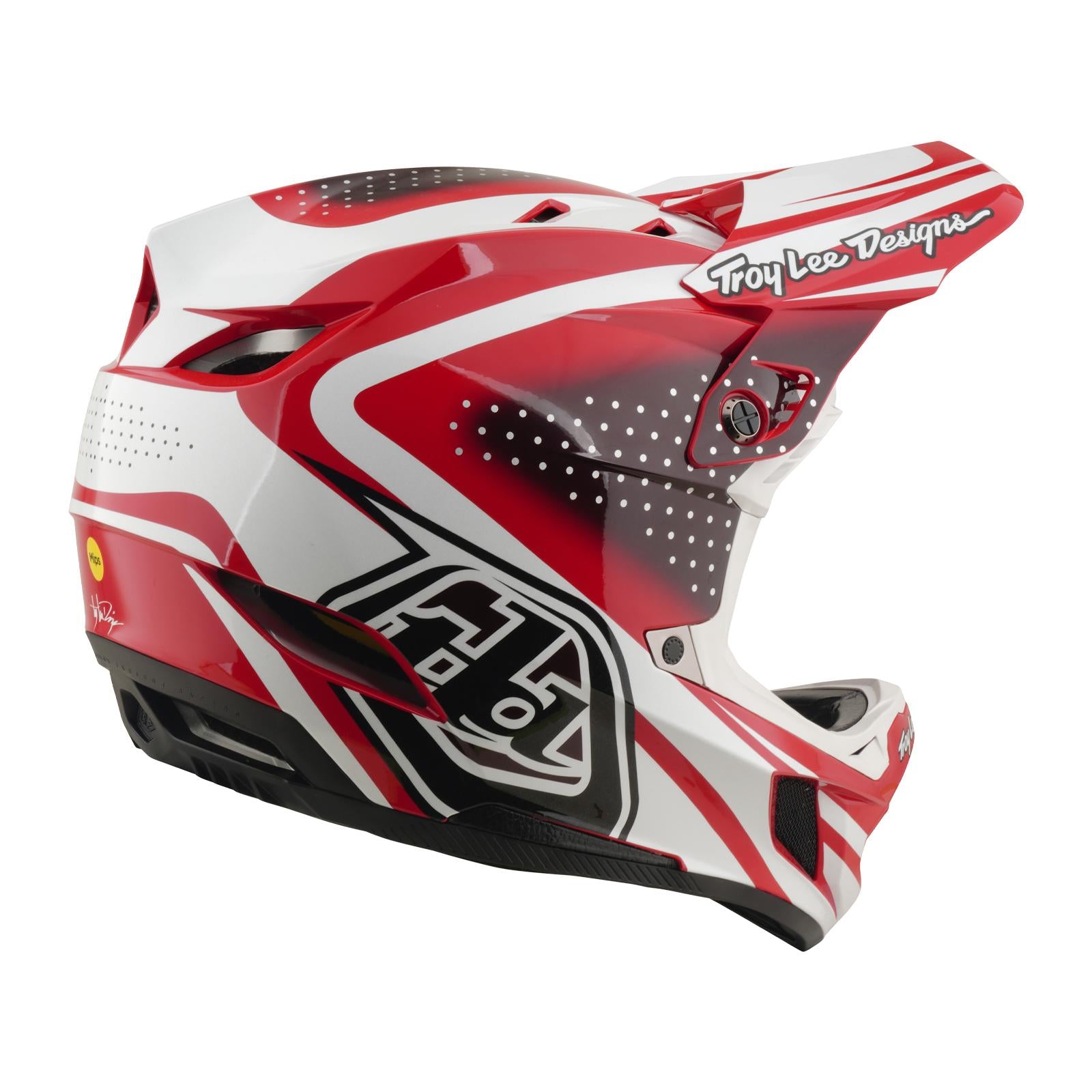 The TLD 26.1 D4 AS Polyacrylite Helmet in The Line Fire/White features an angular, red-and-white full-face design, ventilation holes, Mips brain protection, and Troy Lee Designs branding—perfect for motocross or mountain biking.