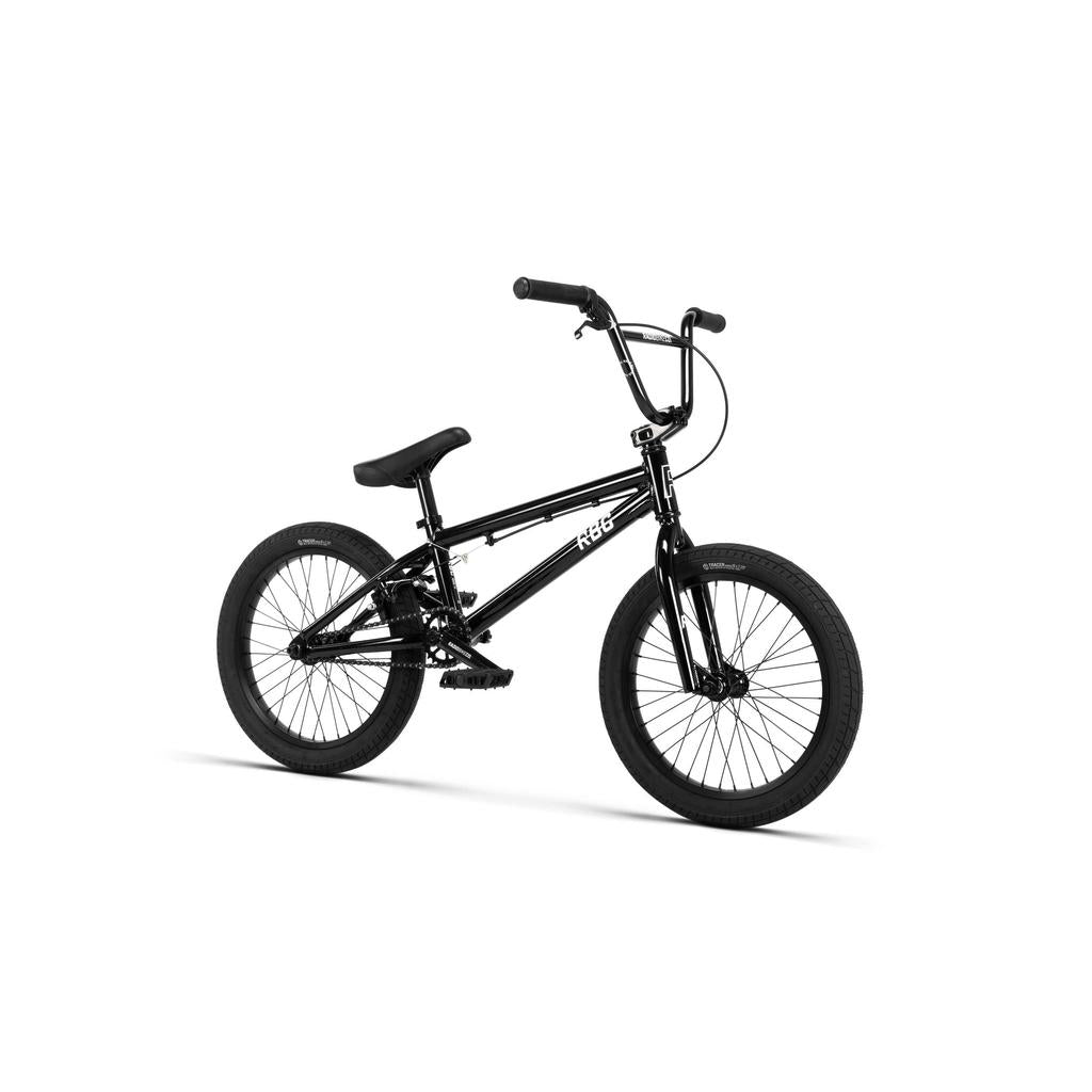 The Radio Dice 18 Inch Bike, featuring a compact black frame, Salt Tracer Tyres, and upright handlebars, is displayed on a white background.