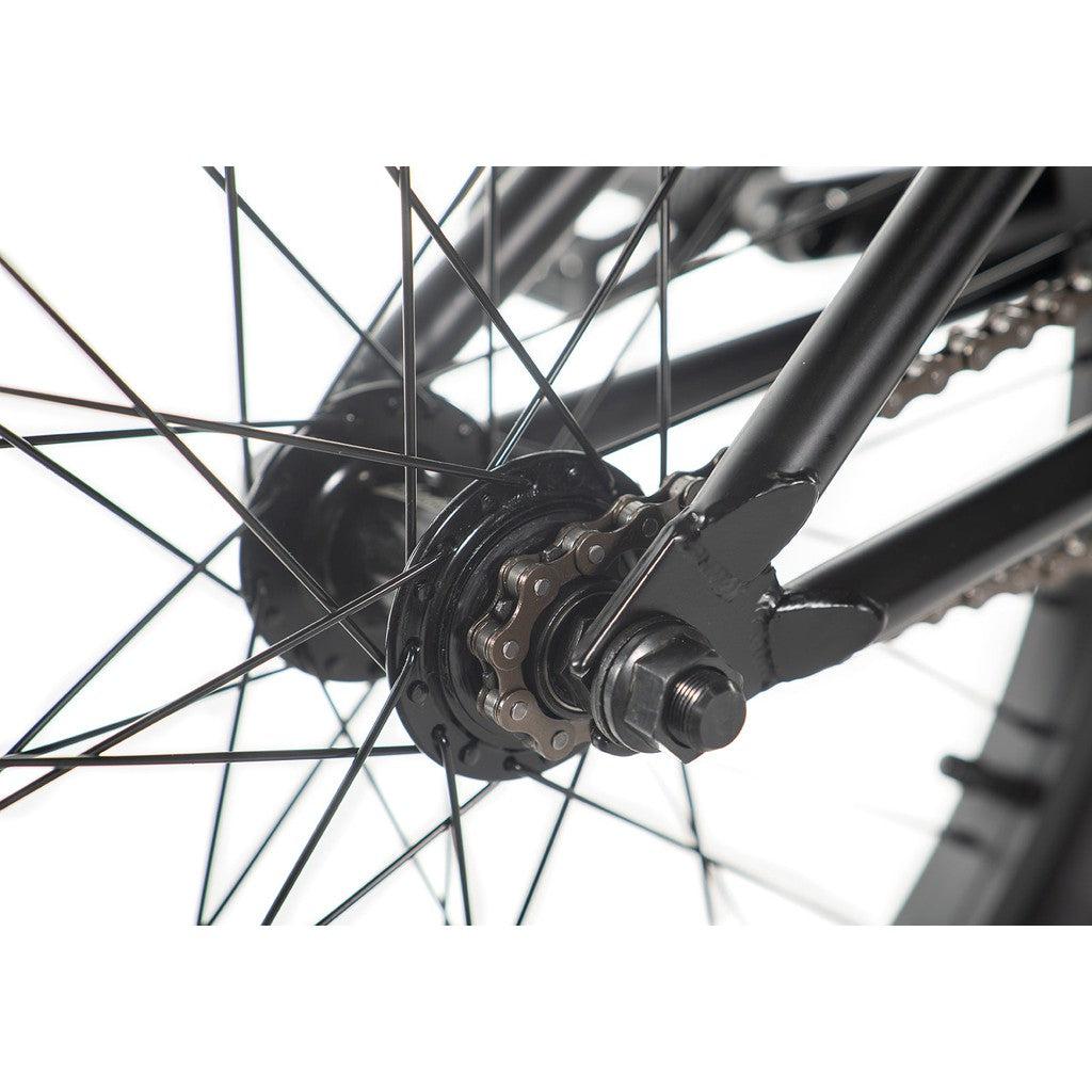 Close-up image of the Academy Entrant 20 Inch Bike's rear wheel hub, showcasing the chain, spokes, and part of the frame—perfect details found in both entry-level BMX riders' bikes and pro-level BMX bikes.
