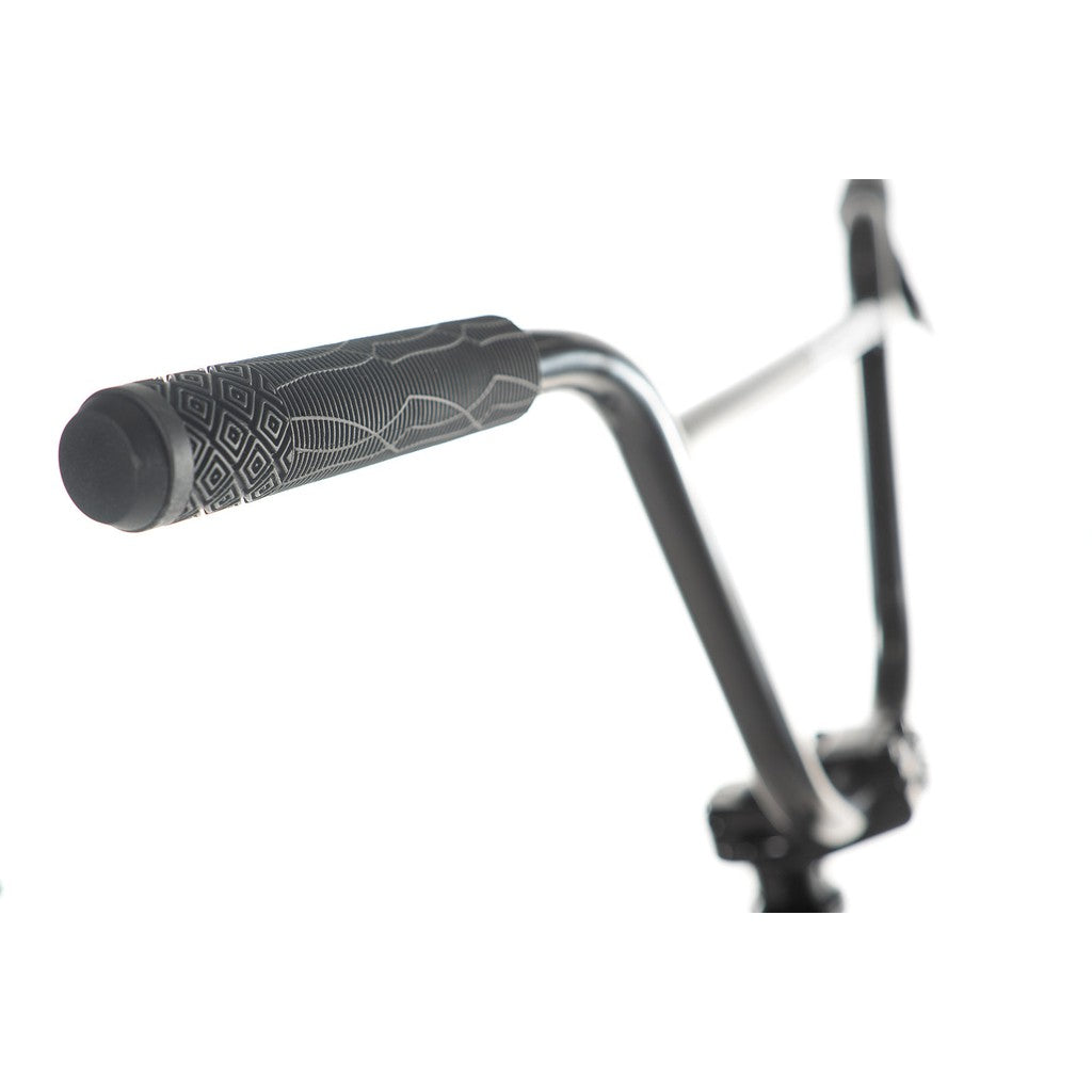 Close-up of the Academy Entrant 20 Inch Bike's handlebar, featuring a textured grip with a geometric pattern, showcased on a white background.