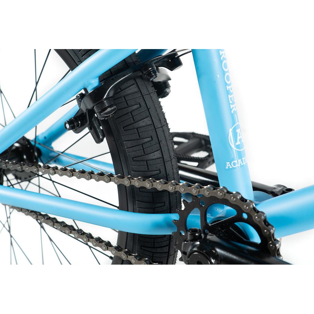 Close-up of the rear wheel, tire, chain, and sprocket on the Academy Trooper 20 Inch Bike, showcasing its drivetrain, brake system, and sealed hubs.