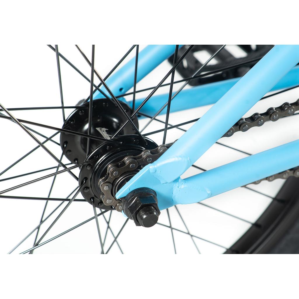 Close-up of the Academy Trooper 20 Inch Bike's rear wheel, highlighting the chain, spokes, axle, and sealed hubs—expertly photographed on a white background to showcase core BMX components.