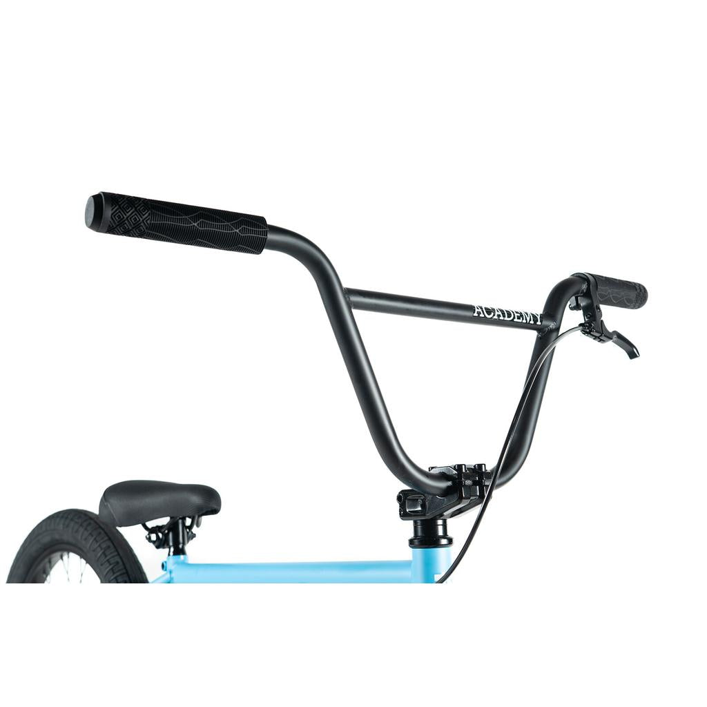 Close-up of the Academy Trooper 20 Inch Bike’s black handlebars and stem on a blue frame, showing a brake lever, sealed hubs, and parts of the seat and rear tire.