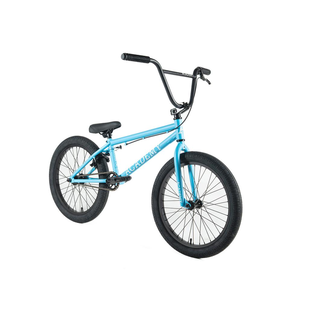 The Academy Trooper 20 Inch Bike is a light blue entry-level BMX with black handlebars, seat, tires, and sealed hubs, displayed at an angle on a white background.