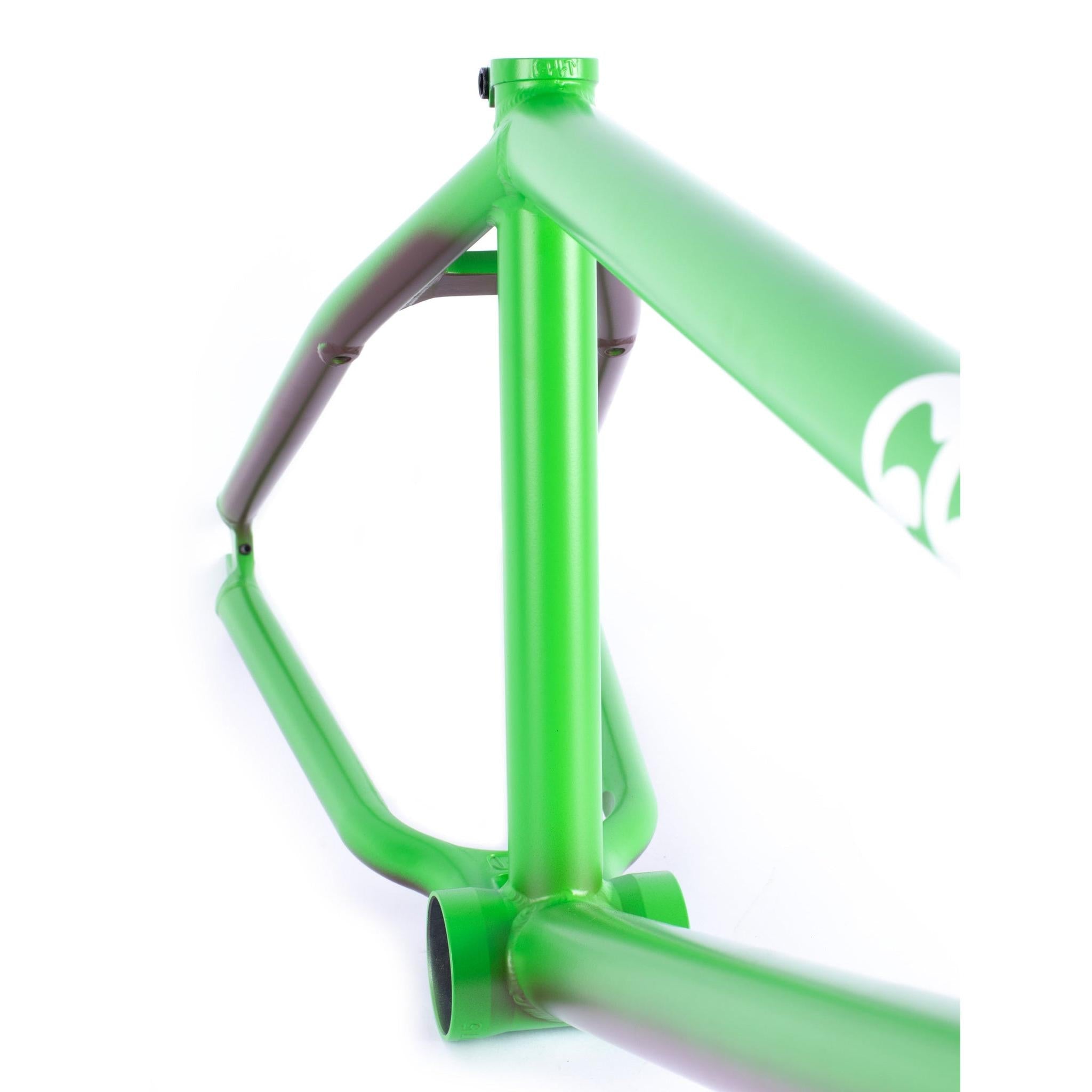Close-up view of the green Cult Biggie Frame (Alex Kennedy Signature) with clean welds, investment cast dropouts, and no components attached, isolated on a white background.