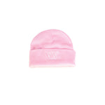 The LUXBMX Ali Beanie - Pink features a light pink soft-knit design, folded brim, and white embroidered logo on the front—perfect for adding warmth and style to your winter wardrobe. Displayed on a plain white background.